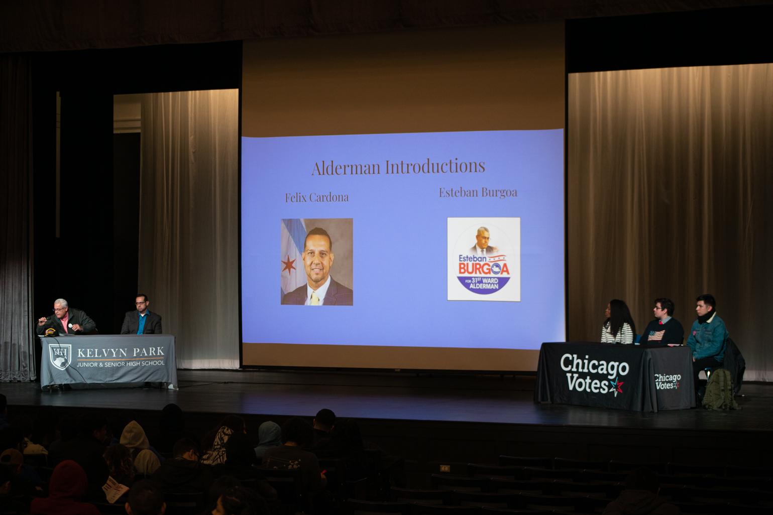 Aldermanic candidates for the 31st Ward and Police District Council candidates for the 25th District take the stage for a Chicago Votes forum at Kelvyn Park High School on Feb. 21, 2023. From left to right, Esteban Burgoa, Felix Cardona Jr., Angelica P. Green, Edgar "Edek" Esparza and Saúl Arellano. (Michael Izquierdo / WTTW News)