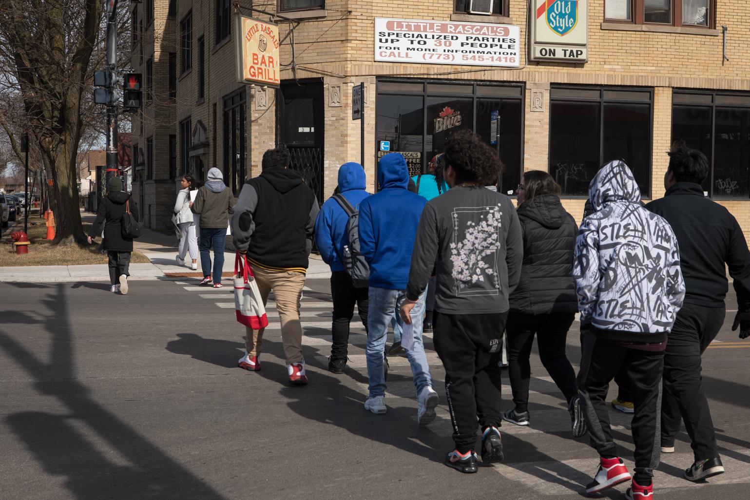 On Feb. 21, 2023, A group of Kelvyn Park High School seniors walk down Kostner Avenue to an early polling location at Kilbourn Park as part of a Chicago Votes “Parade to the Polls” initiative to register students to vote and cast their ballot. (Michael Izquierdo / WTTW News)