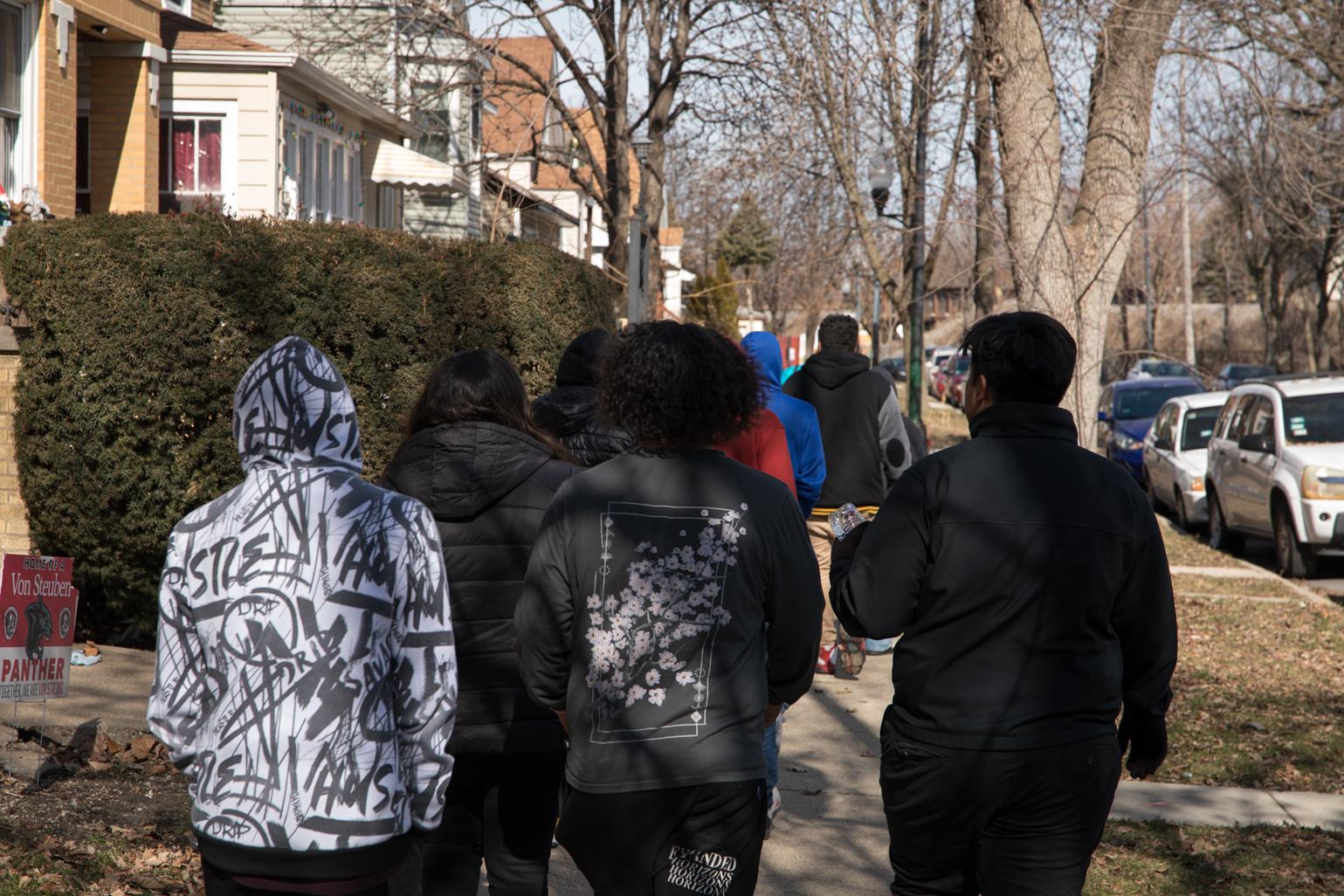 On Feb. 21, 2023, A group of Kelvyn Park High School seniors walk down Kostner Avenue to an early polling location at Kilbourn Park as part of a Chicago Votes “Parade to the Polls” initiative to register students to vote and cast their ballot. (Michael Izquierdo / WTTW News)