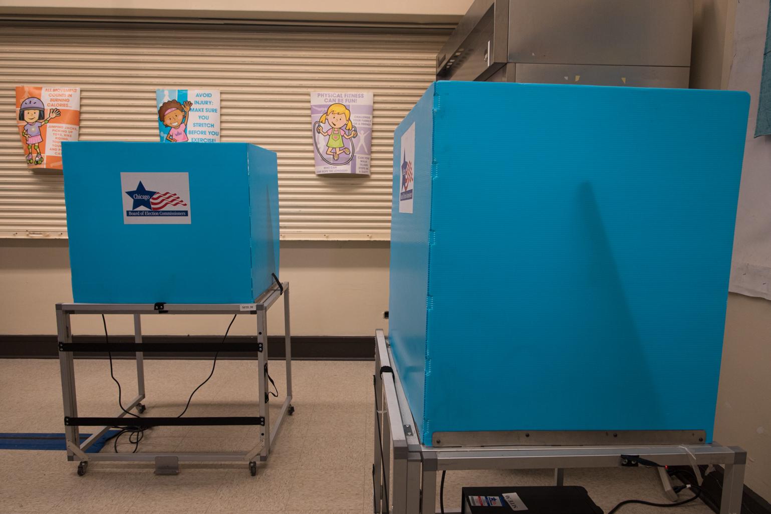 Two voting booths are stationed a few feet away from each other inside the Kilbourn Park polling station. (Michael Izquierdo / WTTW News)