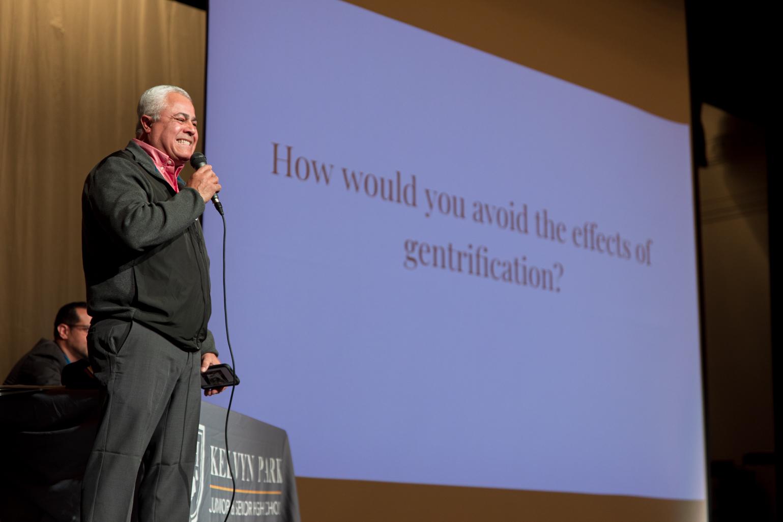 Esteban Burgoa, a City Council candidate for the 31st Ward, addresses a question on how he will avoid the effects of gentrification if elected during a Chicago Votes forum at Kelvyn Park High School on Feb. 21, 2023. (Michael Izquierdo / WTTW News)
