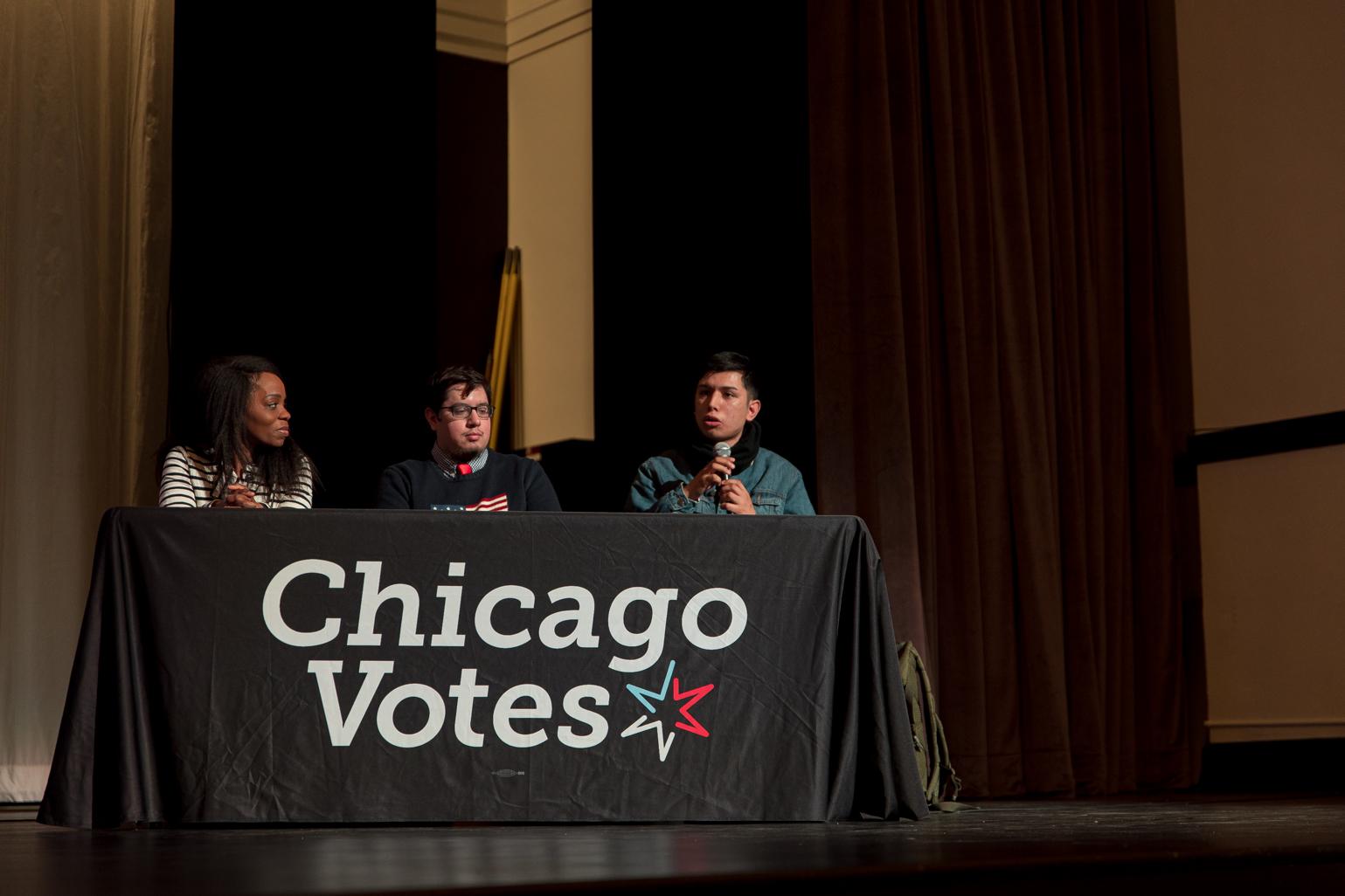 Saúl Arellano, a Police District Council candidate for the 25th District, responds to a question about which movie or TV character is most similar to themselves, answering the actor Denzel Washington “because he’s an African American actor who pushes the voices of other people and uplifts them with him. And for me, that's what we plan to do with this platform to uplift every single member of the community.” (Michael Izquierdo / WTTW News)