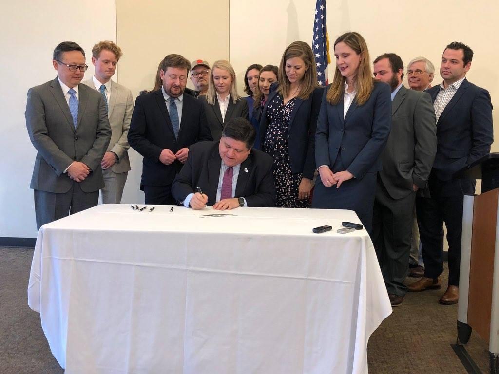 Gov. J.B. Pritzker signs Illinois onto the U.S. Climate Alliance on Jan. 23, 2019. (Courtesy Illinois Environmental Council)