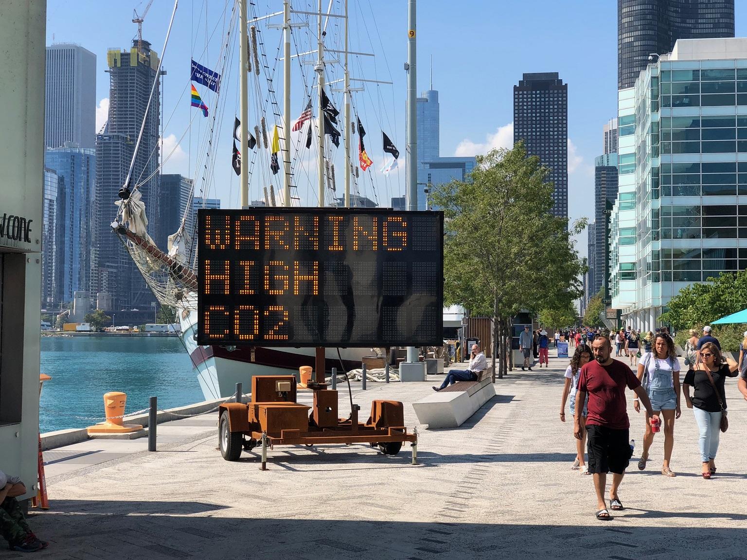 A new art installation at Navy Pier uses a solar-powered highway message board to warn of the dangers of climate change. (Alex Ruppenthal / Chicago Tonight)