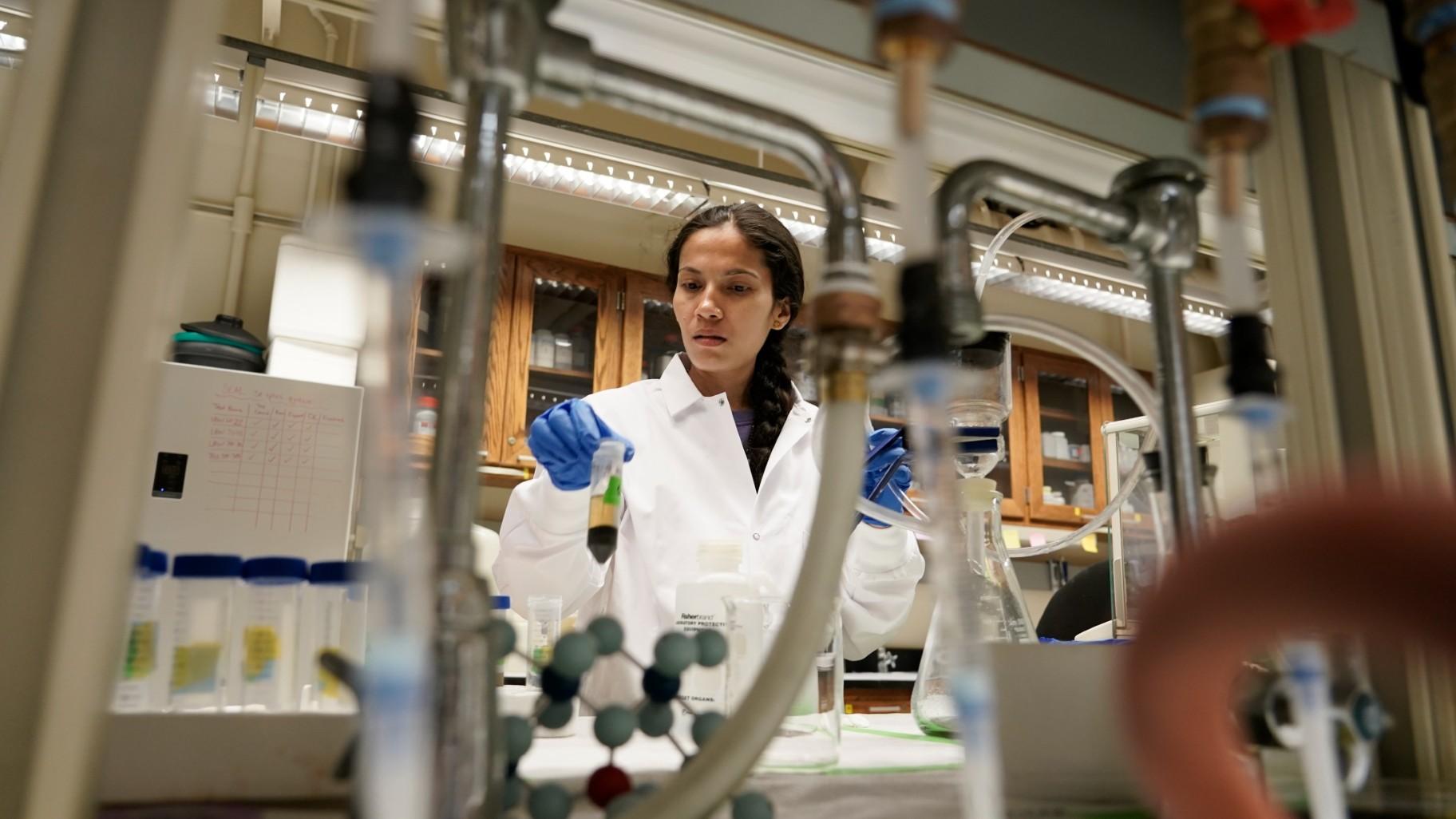Soil researcher Asmita Gautam, a Ph.D. candidate at Purdue University, prepares a soil sample for carbon content analysis, July 13, 2023, in West Lafayette, Ind. (AP Photo / Joshua A. Bickel, File)