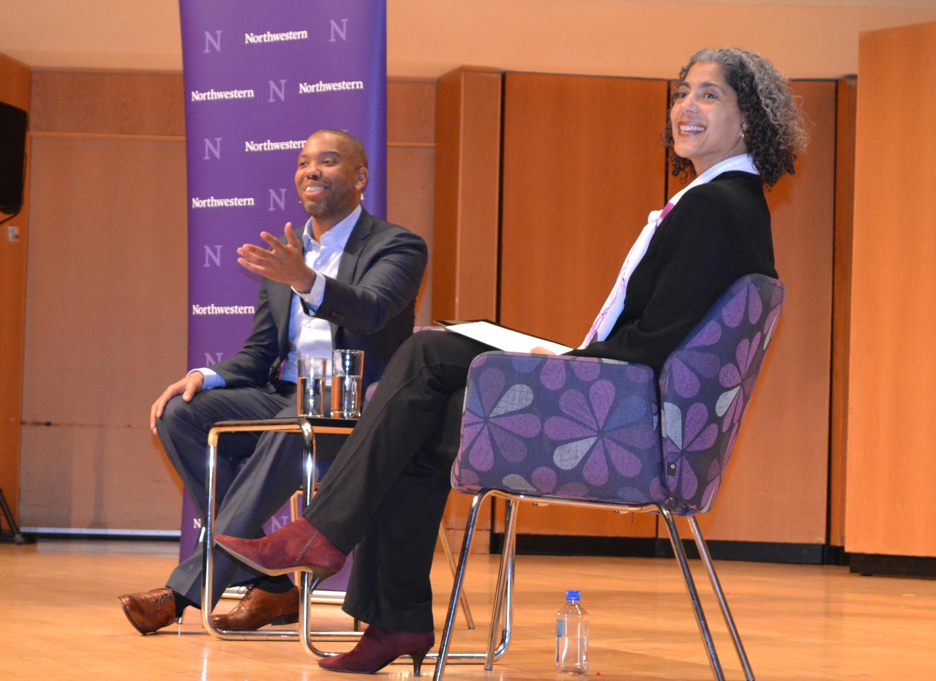 Ta-Nehisi Coates waves to individuals who he interviewed for his seminal piece, The Case for Reparations, who were in the audience at Tuesday night's discussion with professor Mary Pattillo. (Maya Miller / Chicago Tonight)