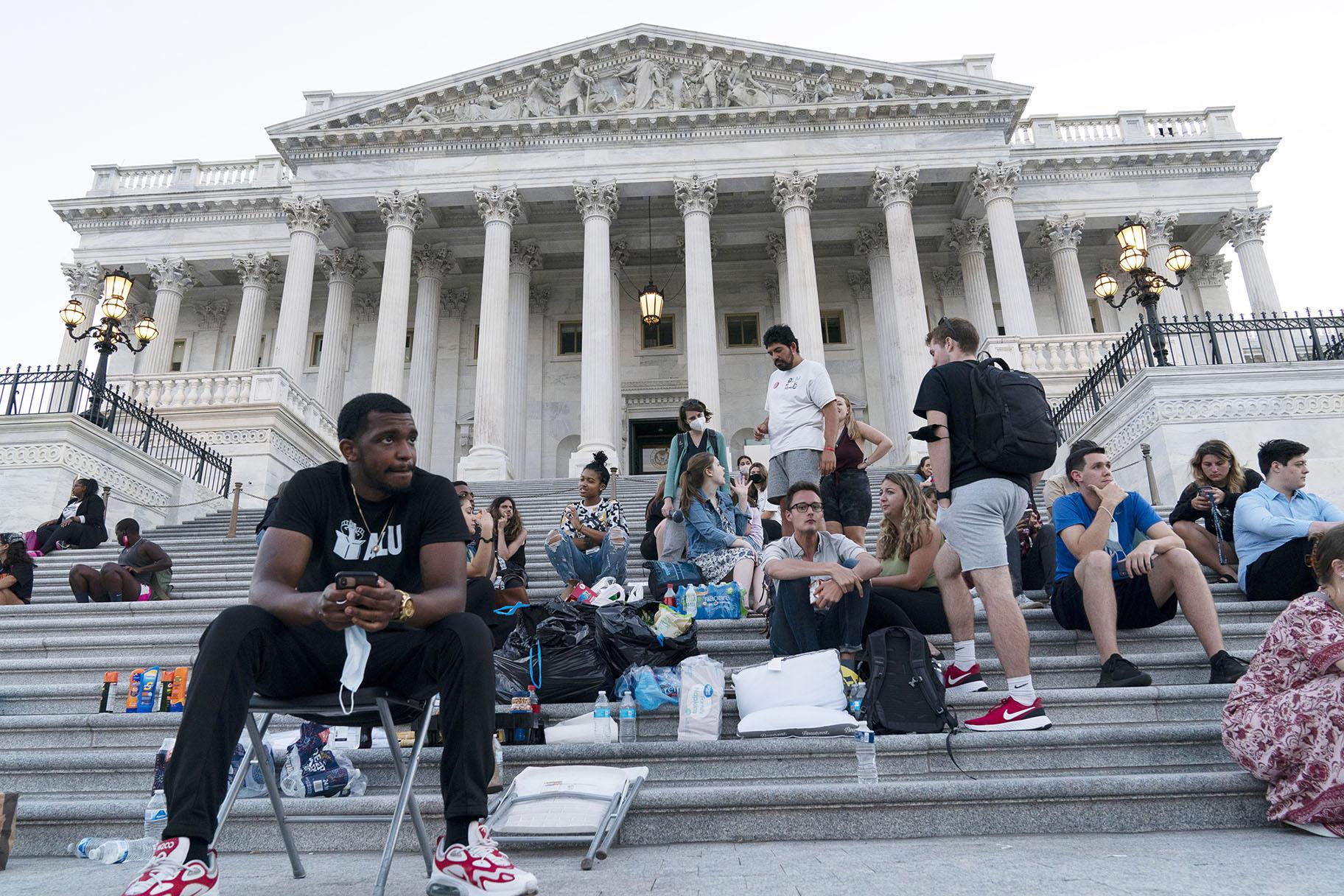 Supporters of Rep. Cori Bush, D-Mo., camp with her outside the U.S. Capitol, in Washington, Monday, Aug. 2, 2021, as anger and frustration has mounted in Congress after a nationwide eviction moratorium expired at midnight Saturday. (AP Photo / Jose Luis Magana)