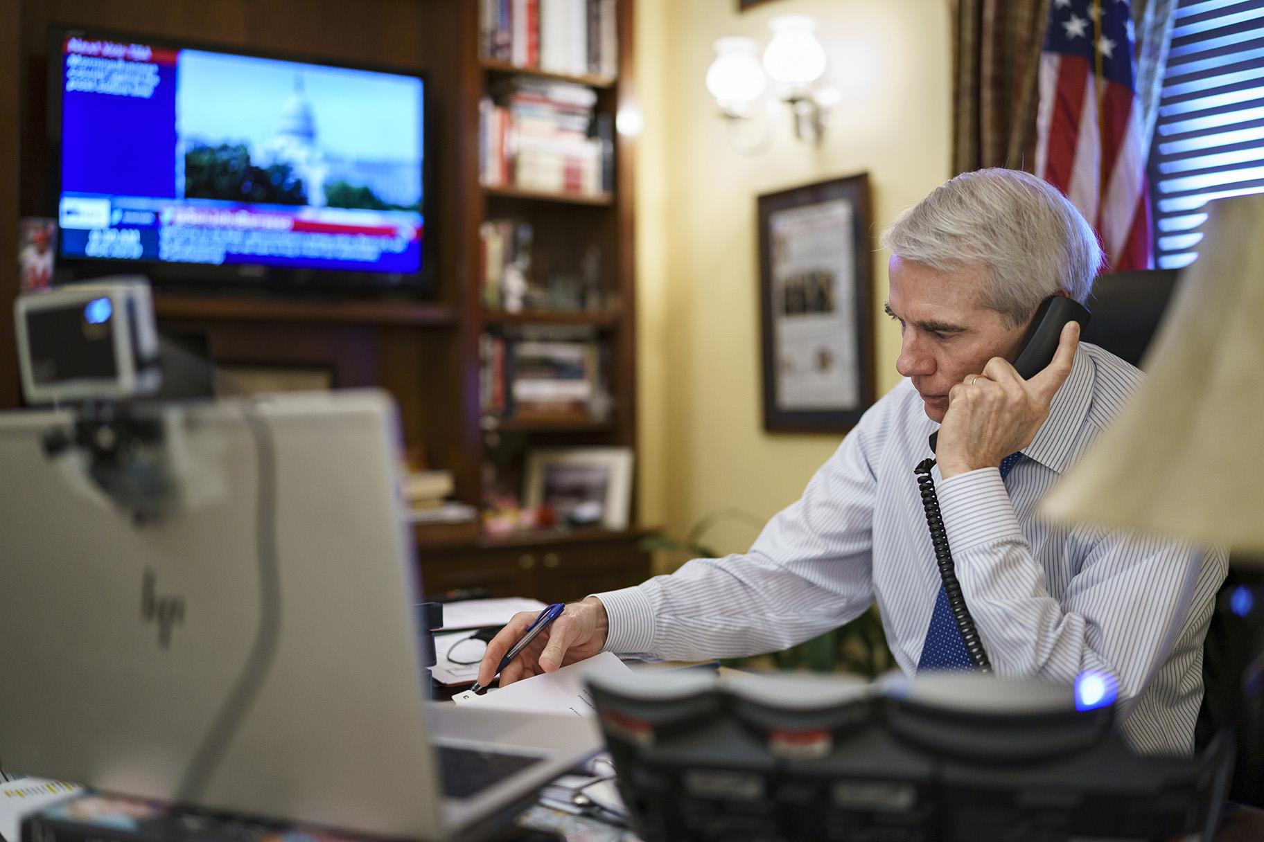 Sen. Rob Portman, R-Ohio, the top Republican negotiator on the bipartisan infrastructure bill, works from his office on Capitol Hill as he continues to shepherd the  trillion legislation closer to passage, in Washington, Monday, Aug. 9, 2021. (AP Photo / J. Scott Applewhite)