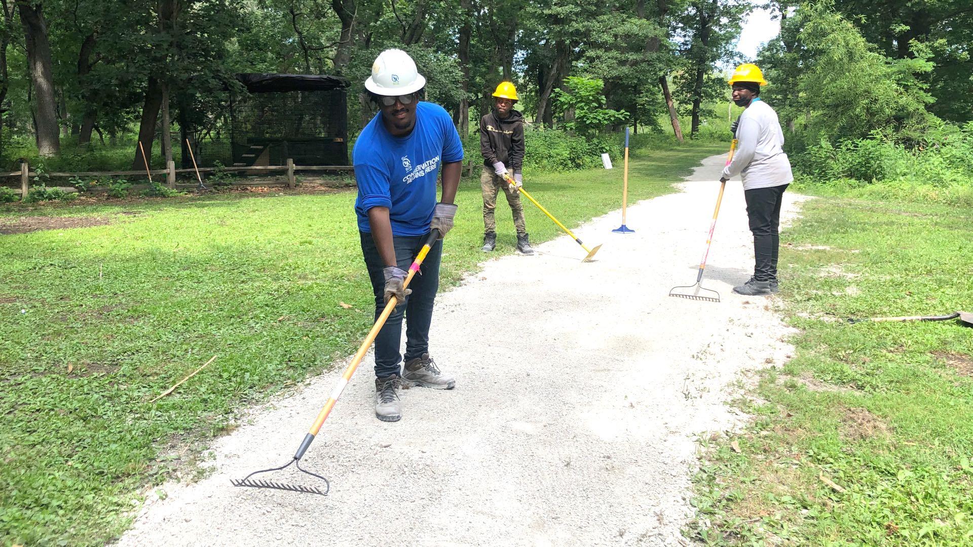 Conservation Corps members making trail improvements at Sand Ridge Nature Center, August 2022. (Patty Wetli / WTTW News)