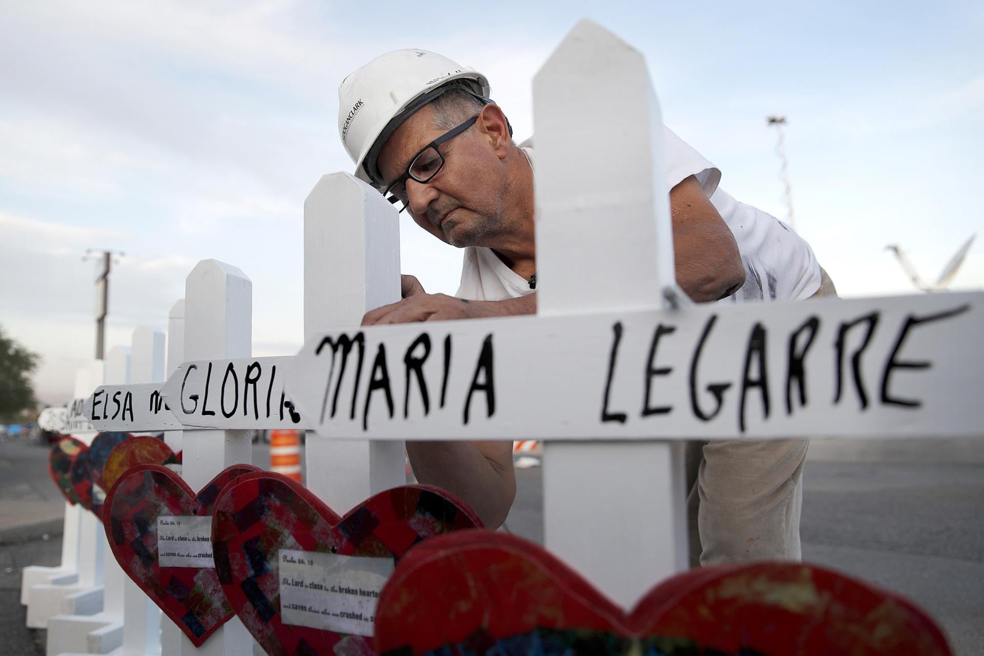 In this Aug. 5, 2019, file photo Greg Zanis of Aurora prepares crosses to place at a makeshift memorial for victims of a mass shooting at a shopping complex in El Paso, Texas. (AP Photo / John Locher, File)