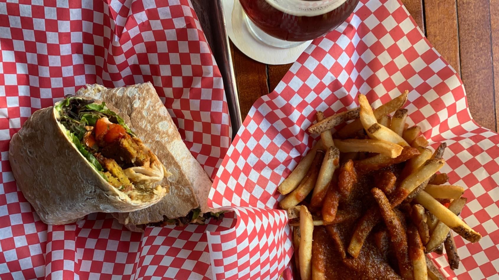  Vegan Seitan Döner Kebab Wrap and Vegan Curry Fries at DMen Tap (Eunice Alpasan / WTTW News)