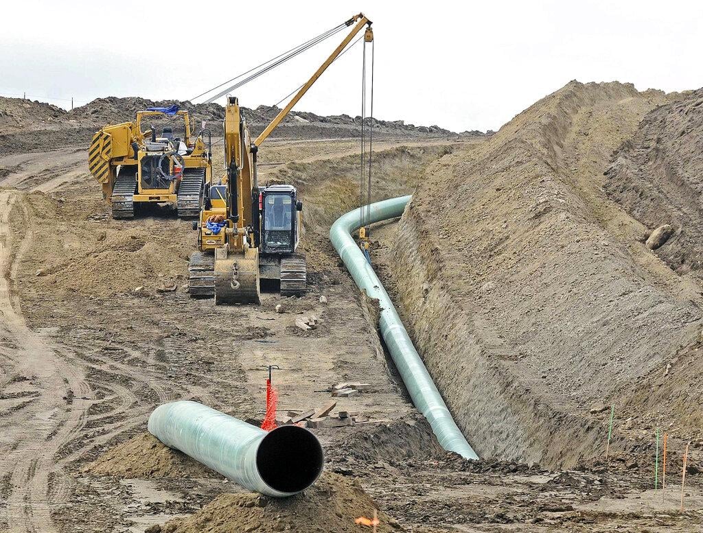 In this Oct. 5, 2016, file photo, heavy equipment is seen at a site where sections of the Dakota Access pipeline were being buried near the town of St. Anthony in Morton County, N.D. (Tom Stromme / The Bismarck Tribune via AP, File)