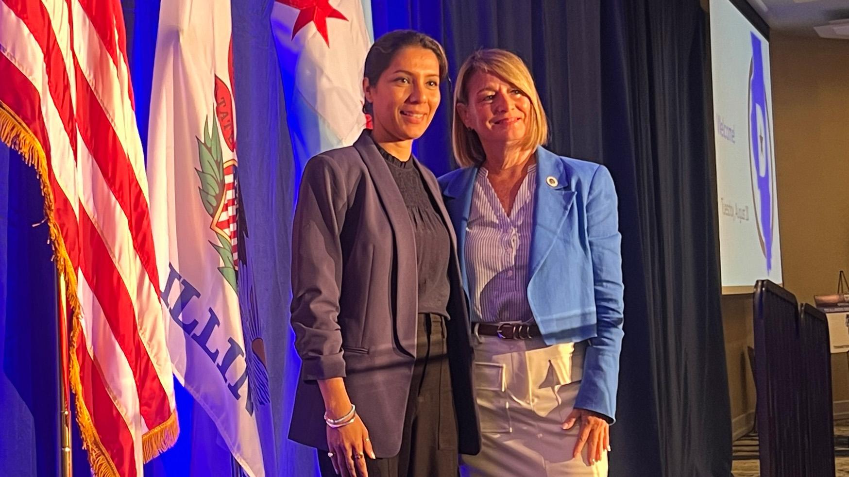 DuPage County Chair Deb Conroy, right, poses with DuPage County board candidate Saba Haider at the Illinois delegation breakfast on Aug. 20, 2024. (Amanda Vinicky / WTTW News)