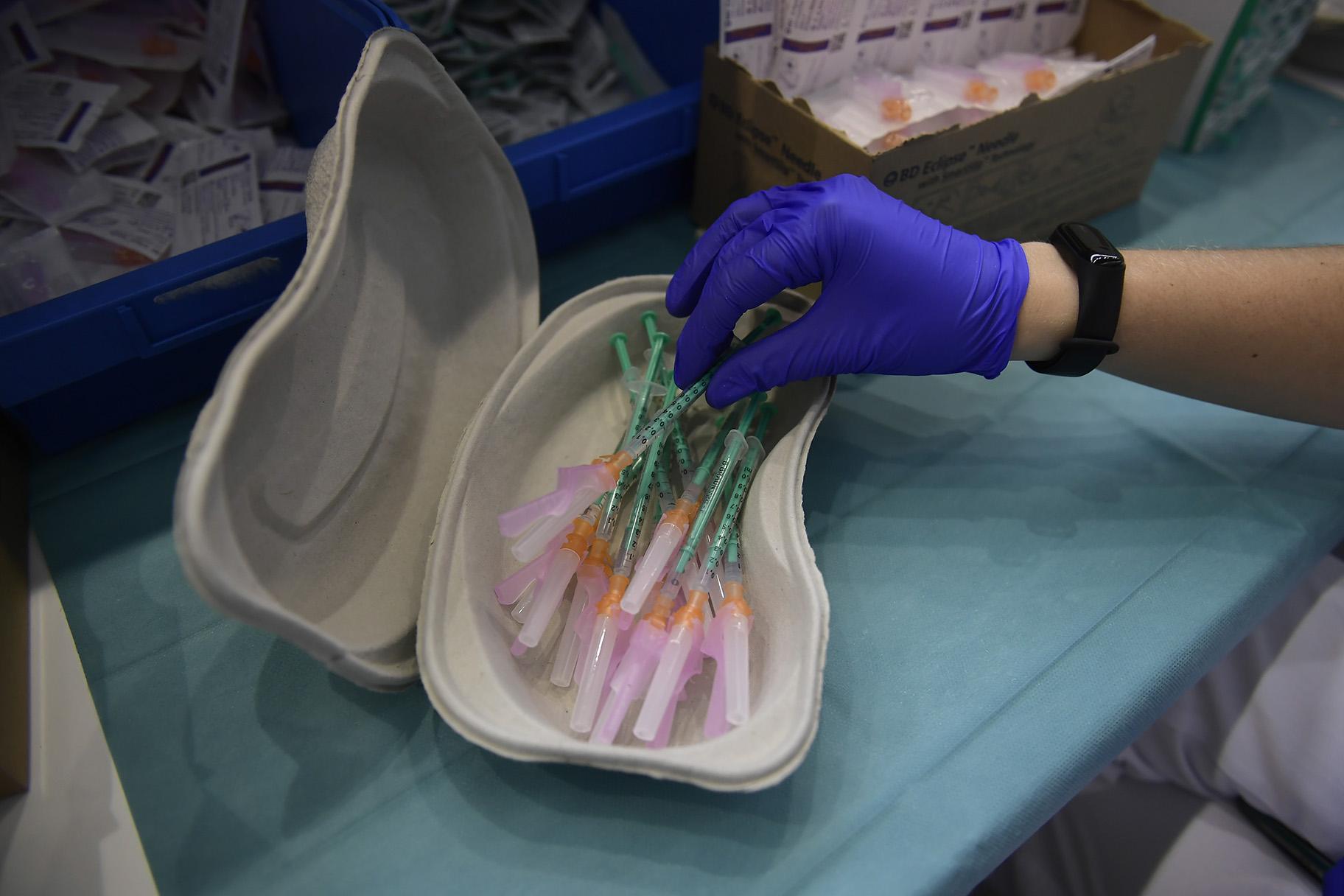 In this Thursday, Sept. 2, 2021 file photo, a health worker prepares Pfizer vaccines during the national COVID-19 vaccination campaign in Pamplona, northern Spain. (AP Photo / Alvaro Barrientos, File)
