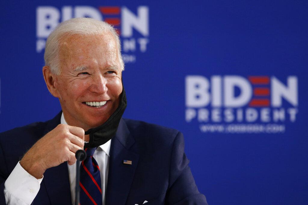 In this June 11, 2020, file photo Democratic presidential candidate former Vice President Joe Biden smiles while speaking during a roundtable on economic reopening with community members in Philadelphia. (AP Photo / Matt Slocum, File)