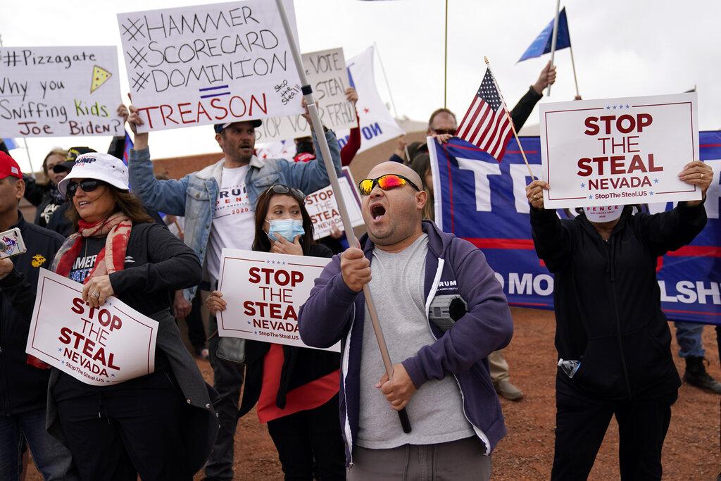 Supporters of President Donald Trump protest outside of the Clark County Elections Department in North Las Vegas, Nev., Saturday, Nov. 7, 2020. (AP Photo / John Locher)