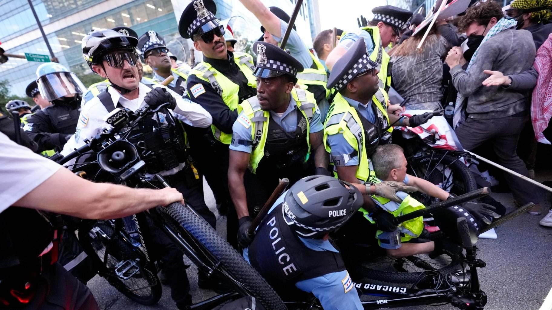 Demonstrators clash with police near the Israeli Consulate during the Democratic National Convention Tuesday, Aug. 20, 2024, in Chicago. (Alex Brandon / AP Photo)