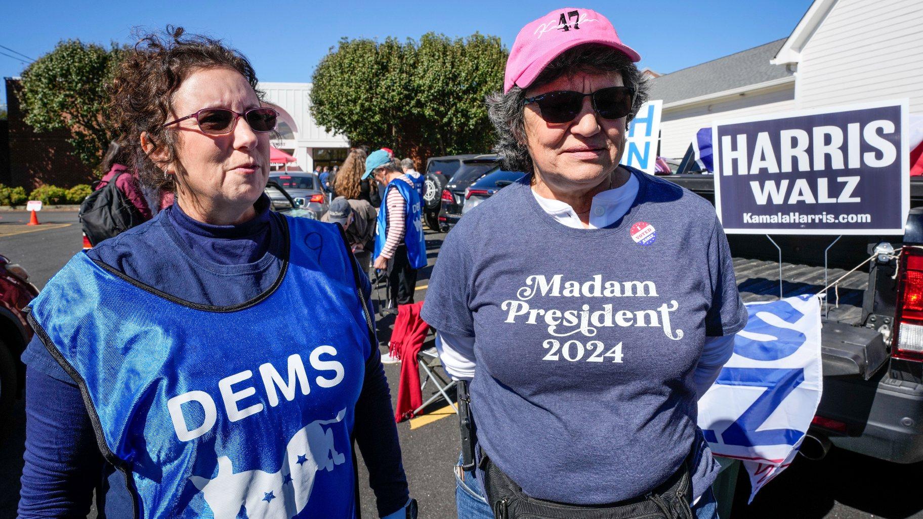 Supporters for Vice President Kamala Harris, Juliette Delgado, left, and Toni Mangan, both of Rutherford County, outside the Rutherford County Annex Building, where early voting was taking place, Thursday, Oct. 17, 2024 in Rutherfordton, N.C. (AP Photo / Kathy Kmonicek)