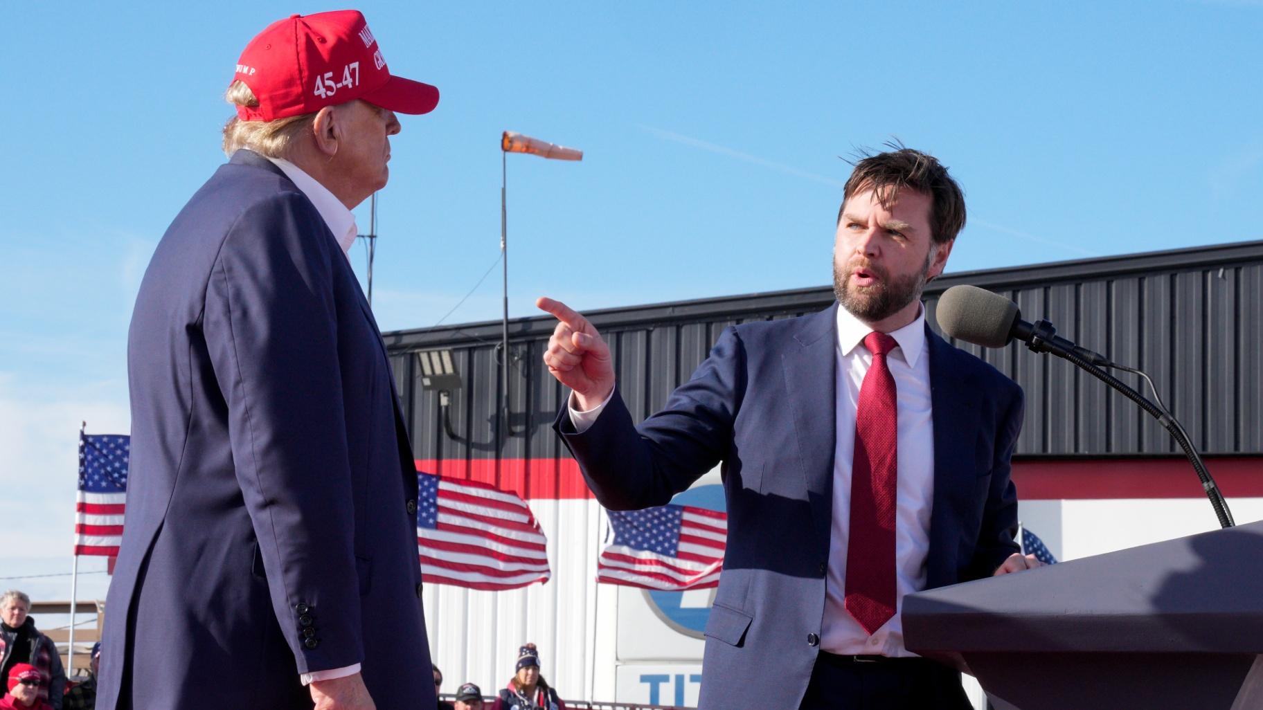 FILE - Sen. J.D. Vance, R-Ohio, right, points toward Republican presidential candidate former President Donald Trump at a campaign rally, March 16, 2024, in Vandalia, Ohio. (Jeff Dean / AP Photo, File)