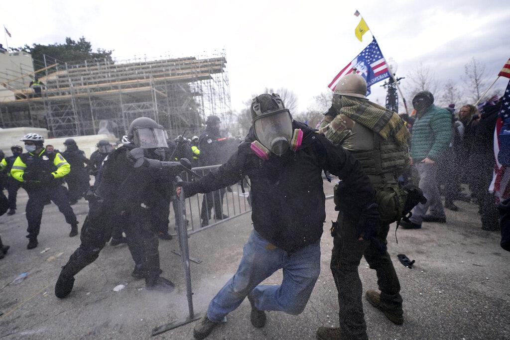 Trump supporters try to break through a police barrier, Wednesday, Jan. 6, 2021, at the Capitol in Washington. (AP Photo / Julio Cortez)