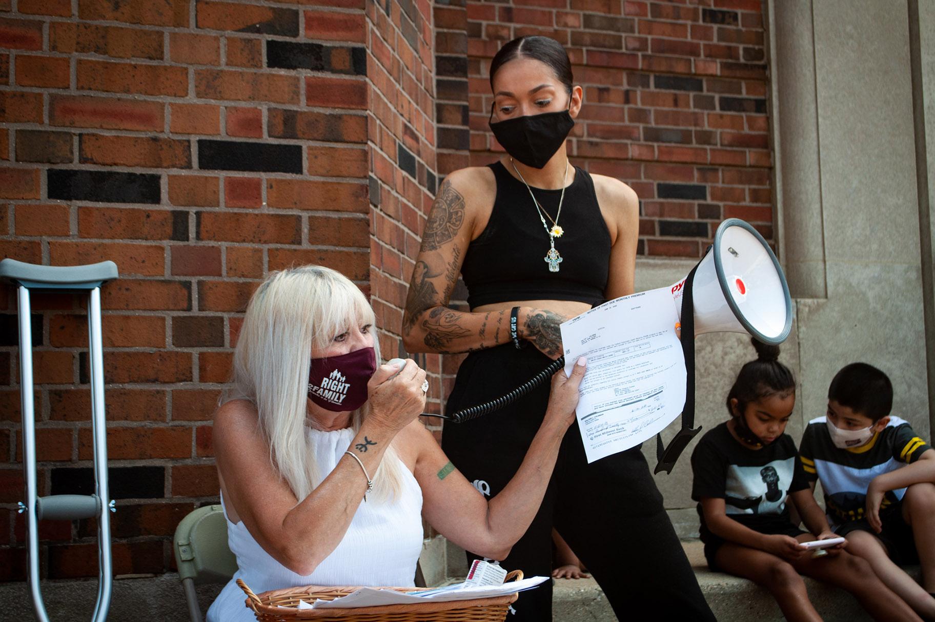 Emma Lozano, left, and Tanya Lopez, speak outside the Pilsen post office on Saturday, Aug. 22, 2020. (Grace Del Vecchio / WTTW News)