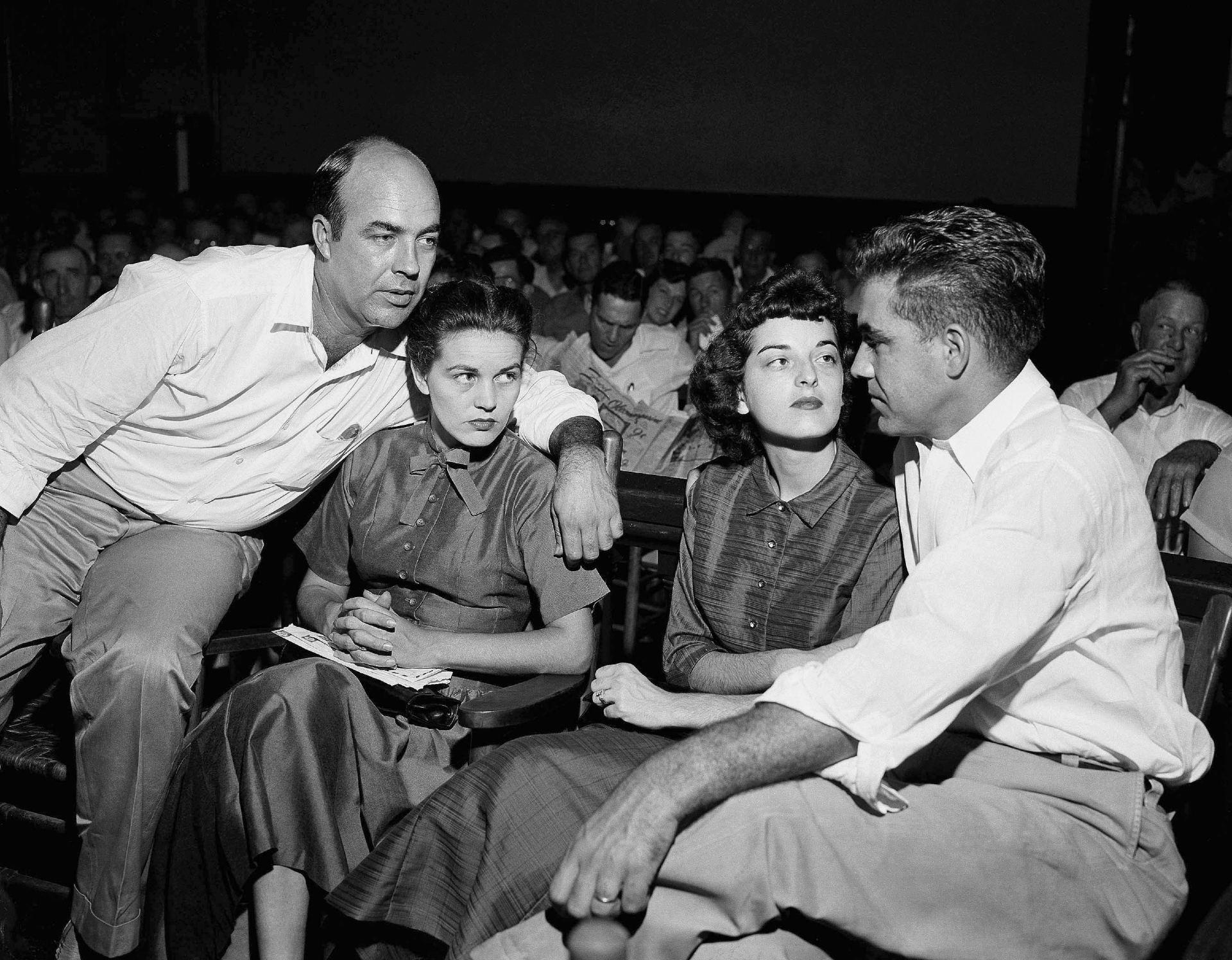 In this Sept. 23, 1955, file photo, J.W. Milam, left, his wife, second from left, Roy Bryant, far right, and his wife, Carolyn Bryant, sit together in a courtroom in Sumner, Miss. (AP Photo, File)