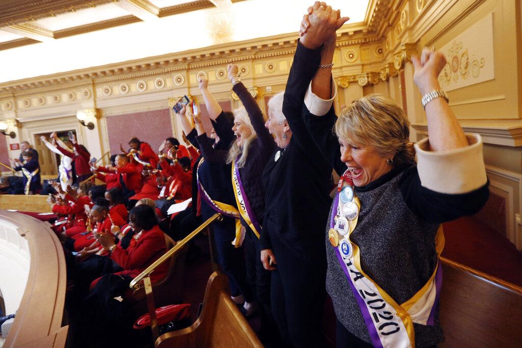 In this Monday, Jan. 27, 2020 file photo, Equal Rights Amendment supporter Donna Granski, right, from Midlothian Va., cheers the passage of the House ERA Resolution in the Senate chambers at the Capitol in Richmond, Va. (AP Photo / Steve Helber, File)