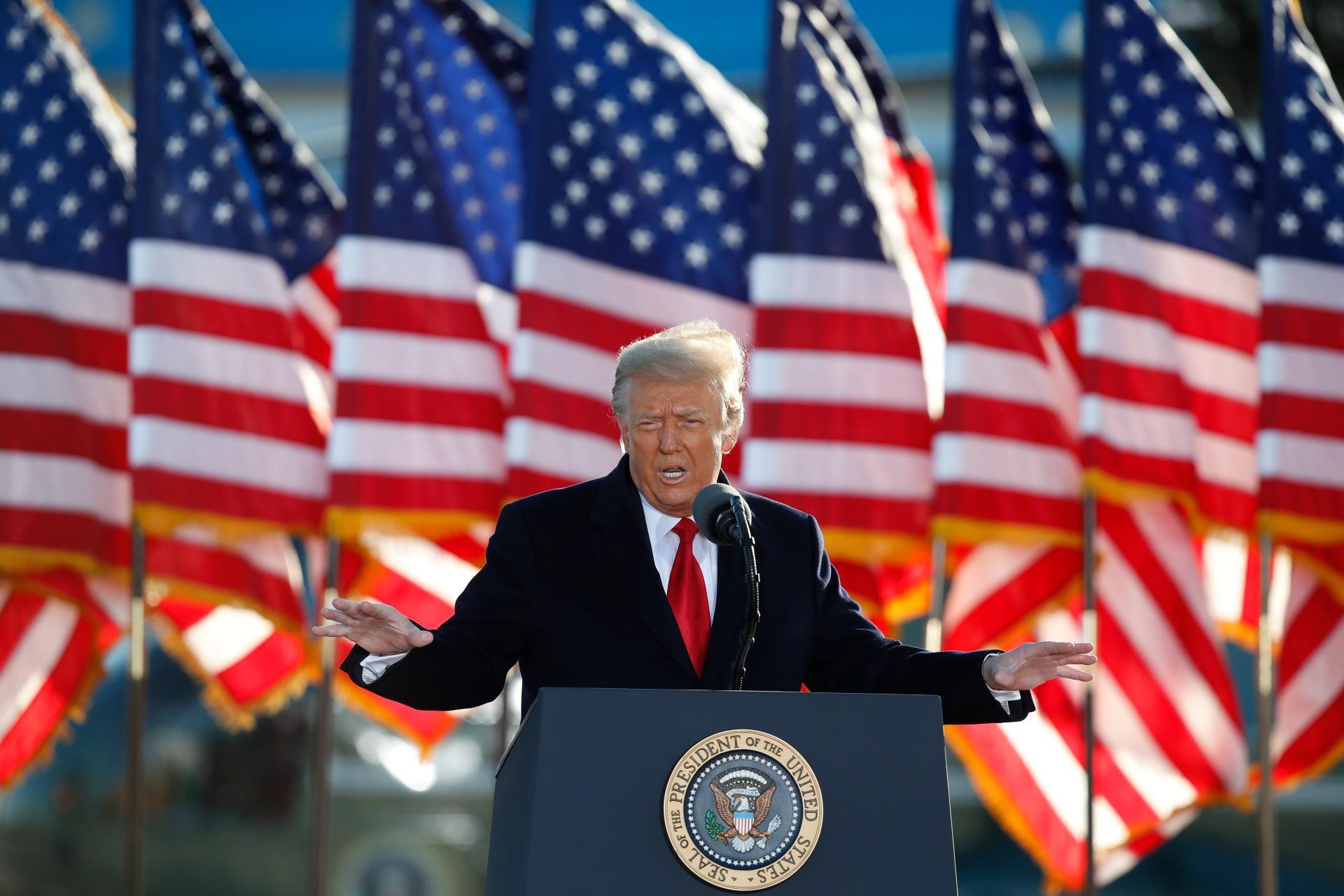 President Donald Trump speaks to crowd before boarding Air Force One at Andrews Air Force Base, Md., in this Wednesday, Jan. 20, 2021, file photo. (AP Photo / Luis M. Alvarez, File)