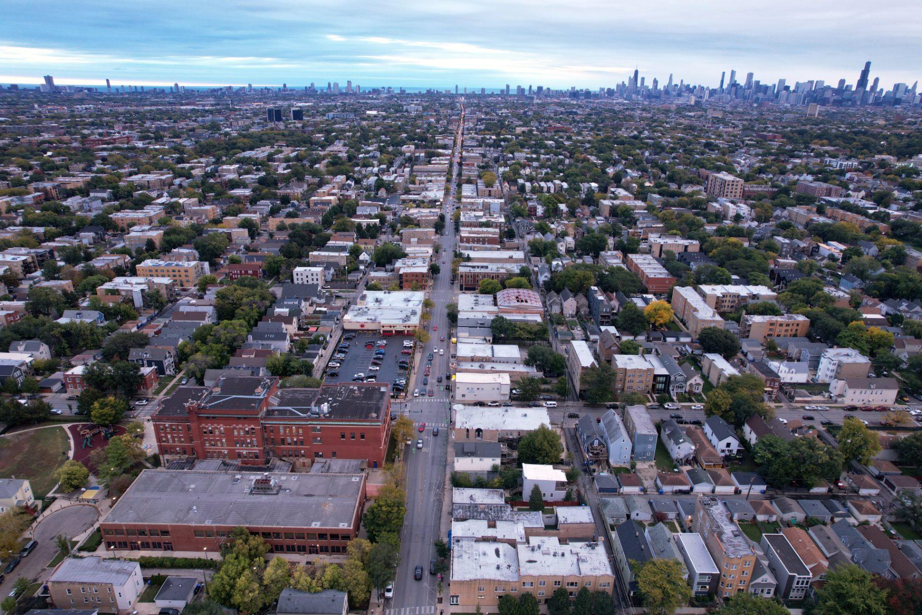 The brick buildings of Funston Elementary School, left, stand in Chicago’s Logan Square neighborhood, with downtown Chicago in the background, Wednesday, Oct. 15, 2025. (AP Photo / Rebecca Blackwell)