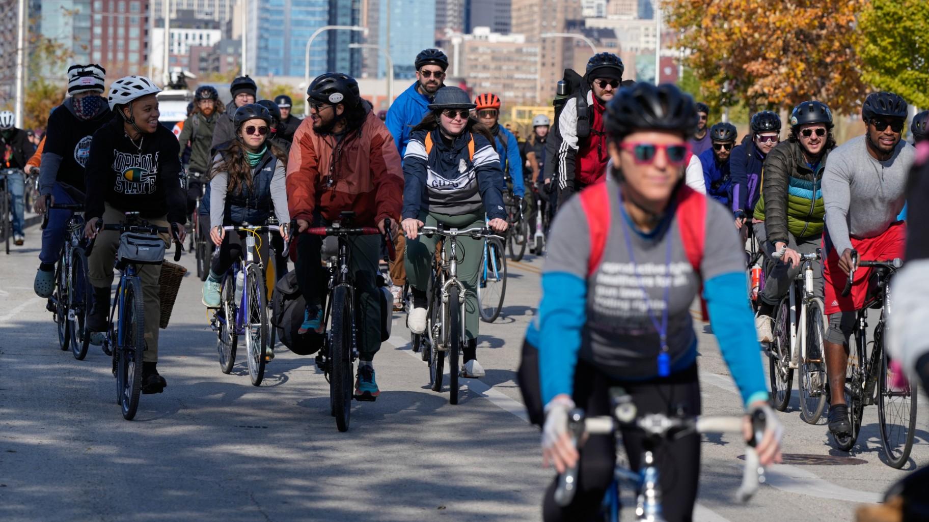 People ride their bicycle during Street Vendor Bike Tour Series, in Chicago, Sunday, Nov. 2, 2025. (AP Photo / Nam Y. Huh)