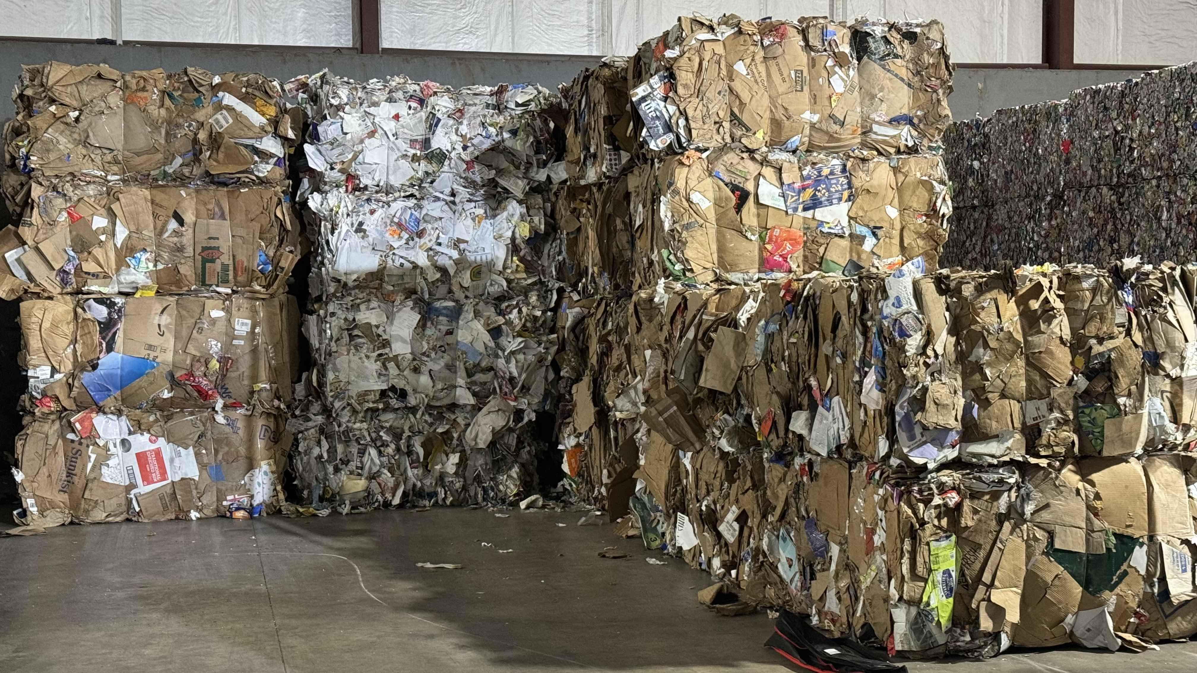 Bales of recycled paper and cardboard, packaged for sale. (Patty Wetli / WTTW News)