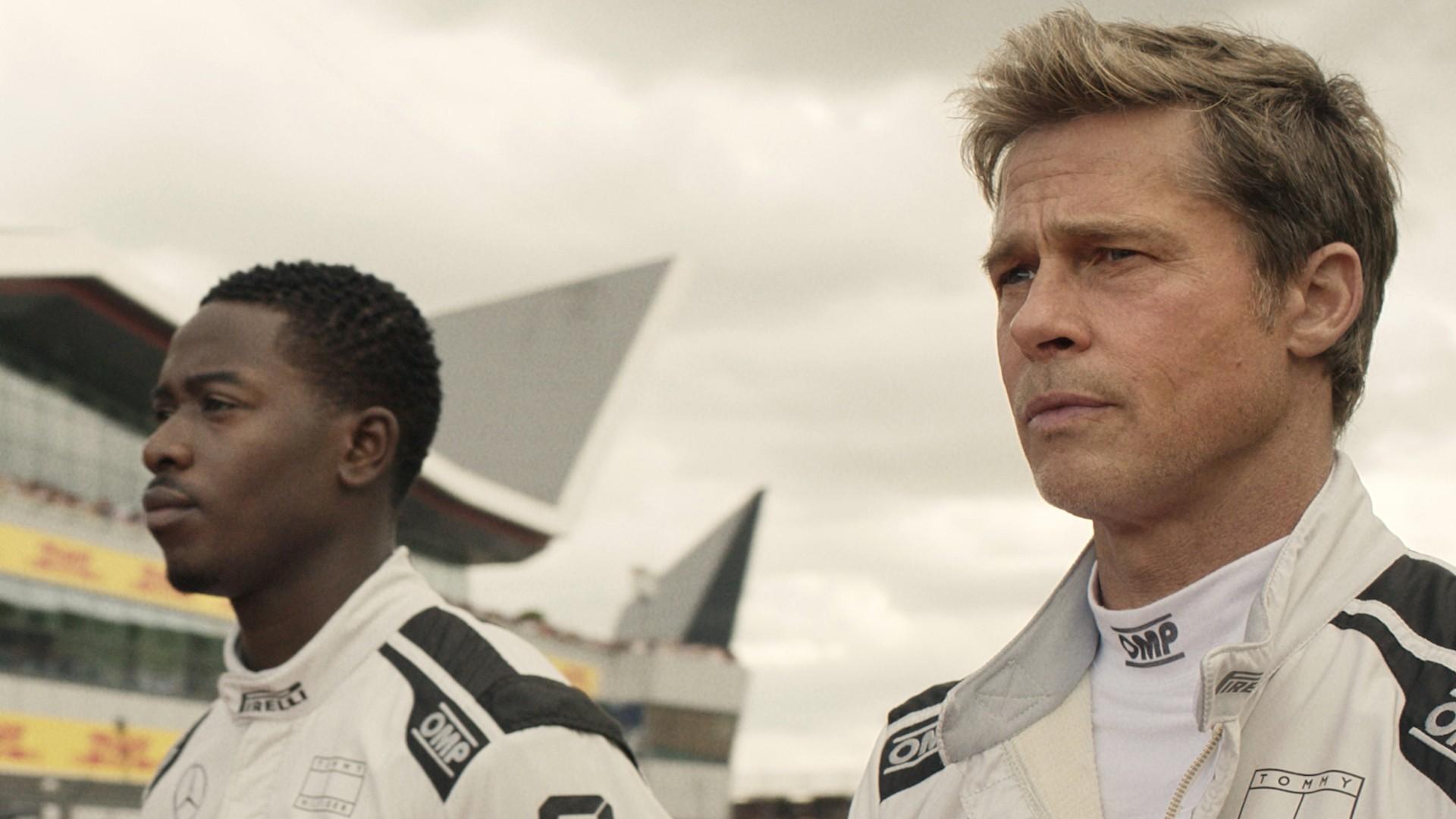 This image released by Warner Bros. Pictures shows Damson Idris, left, and Brad Pitt in a scene from &quot;F1.&quot; (Warner Bros. Pictures via AP)