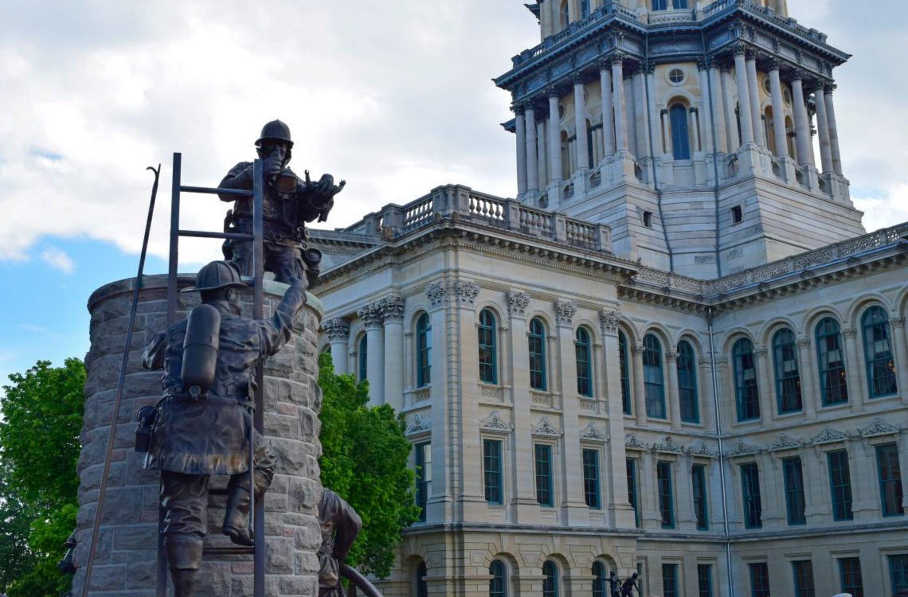The Illinois Firefighters Memorial statue is pictured outside of the Capitol in Springfield. (Jade Aubrey / Capitol News Illinois)