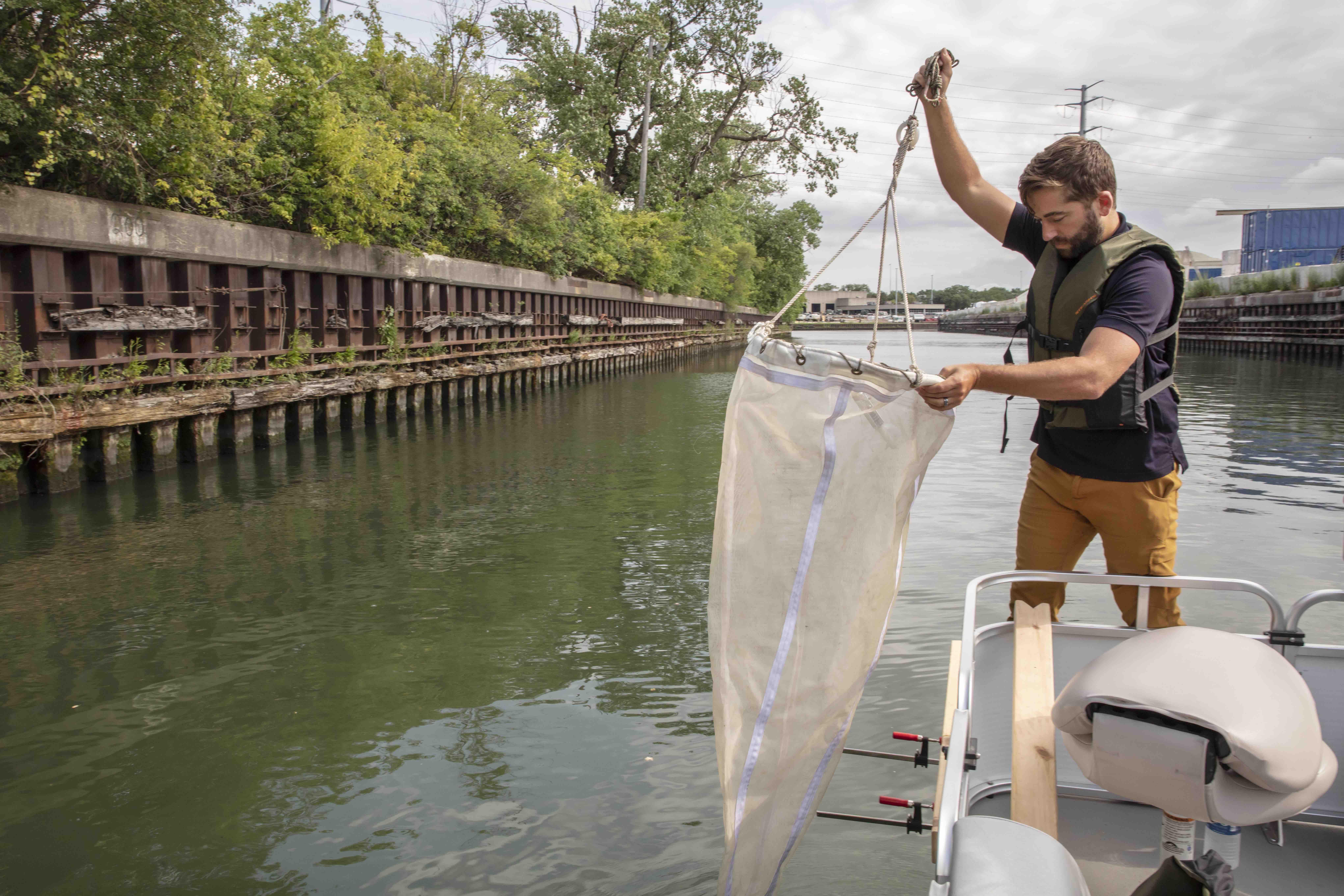 Austin Happel, research biologist at the Shedd Aquarium, is tracking the movement of fish in the Chicago River. (Shedd Aquarium)