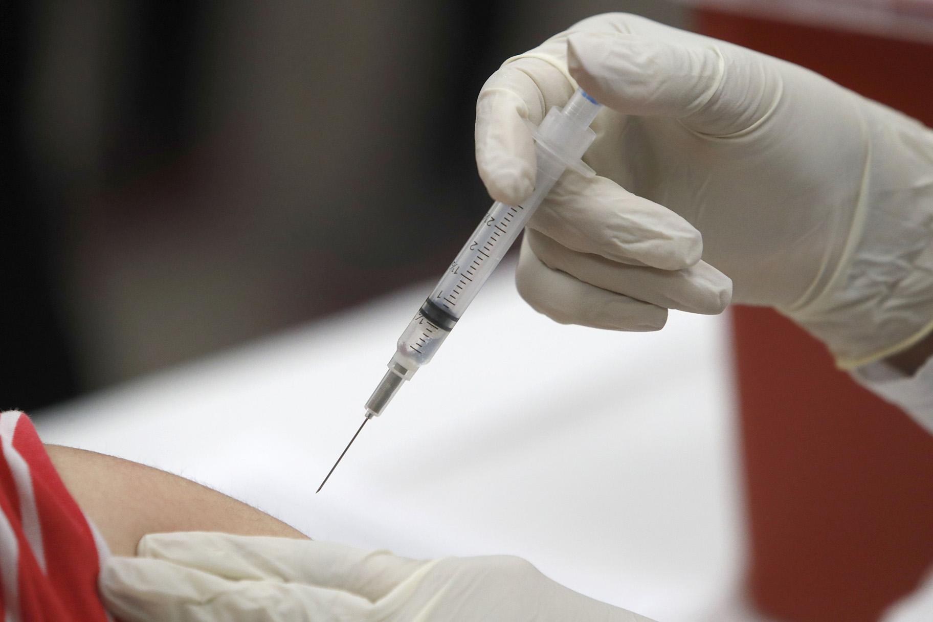 In this Thursday, Jan. 23, 2020, file photo, a patient receives an influenza vaccine in Mesquite, Texas. (AP Photo / LM Otero, File)