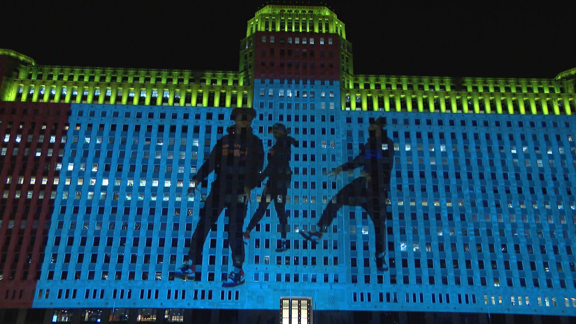 The animated projections of “Footnotes” appear downtown as part of Art on the Mart. (WTTW News)