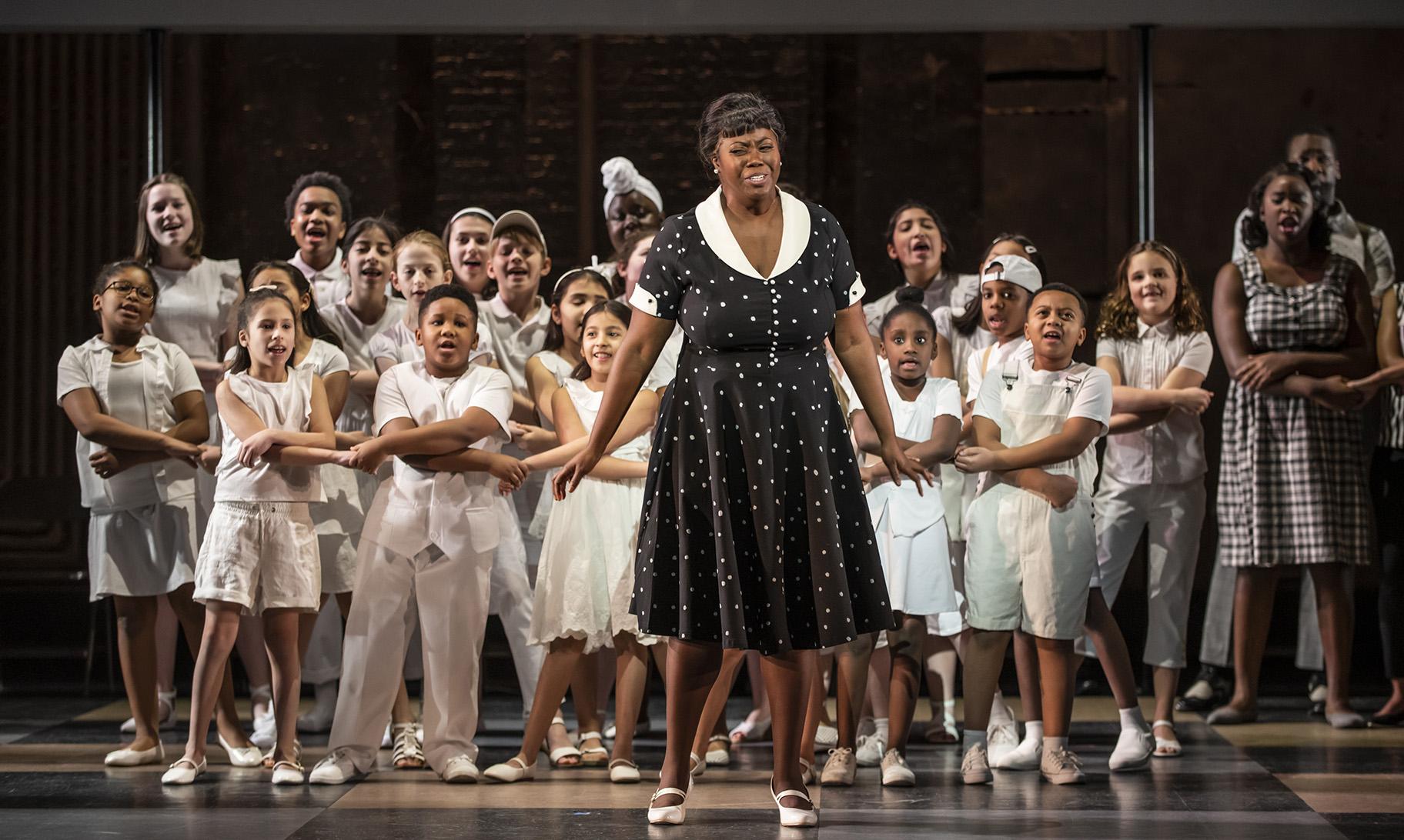 Dara Rahming with children’s chorus in “Freedom Ride.” (Photo credit: Michael Brosilow)