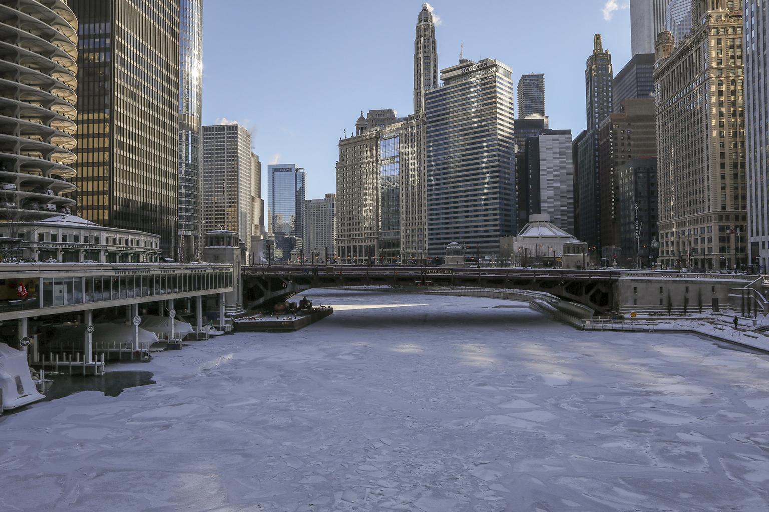 Ice covers the Chicago River on Wednesday, Jan. 30, 2019. A deadly arctic deep freeze enveloped the Midwest with record-breaking temperatures triggering widespread closures of schools and businesses. (AP Photo / Teresa Crawford)