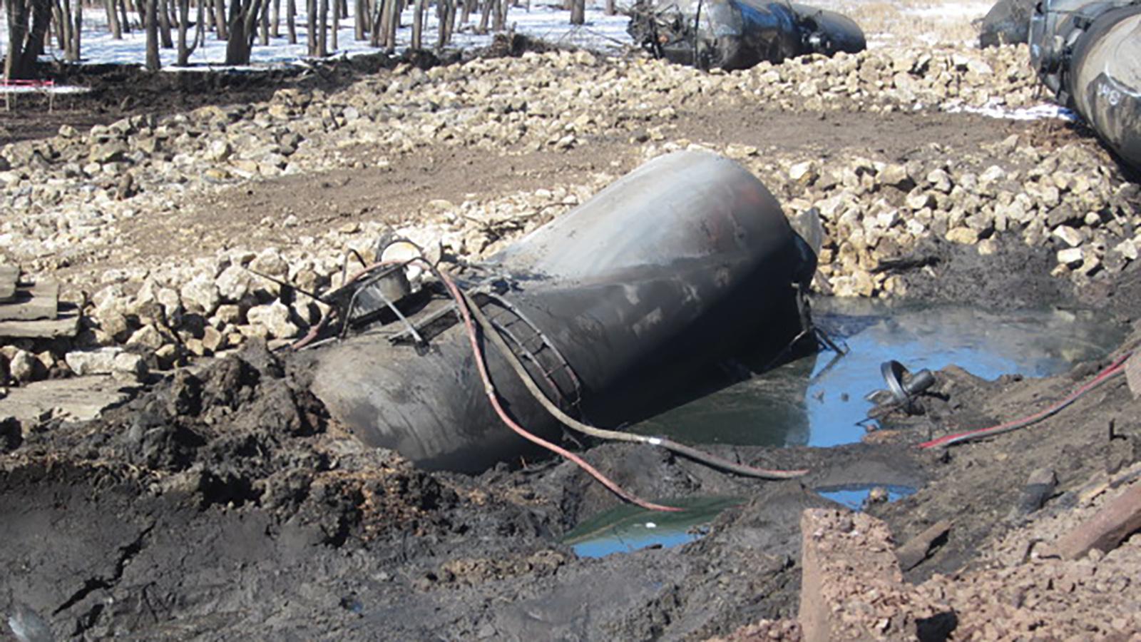 Pools of accumulated crude oil around develop around one of the derailed tank cars as pictured on March 9, 2015, after a derailment in Galena, Illinois. (Environmental Protection Agency)