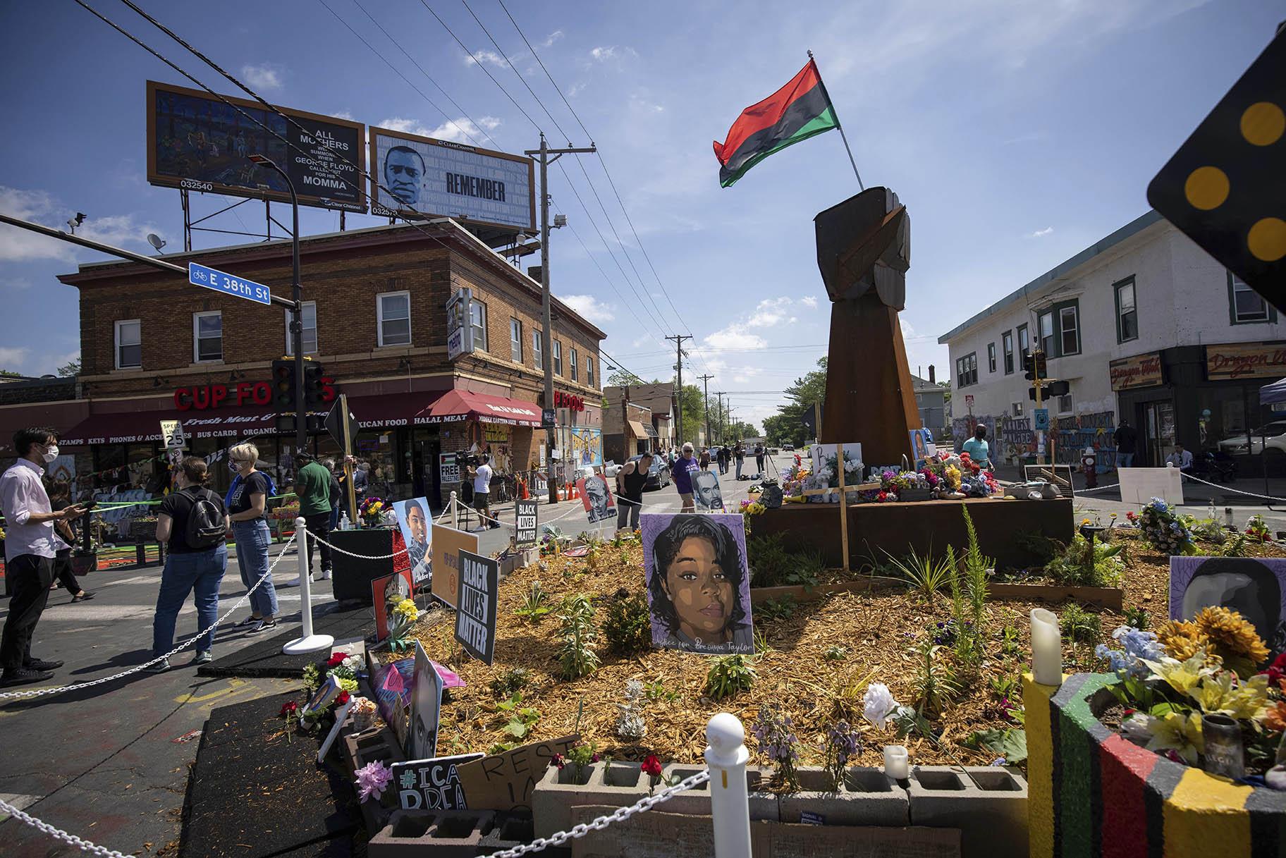 People walk through George Floyd Square after shots were fired on the one year anniversary of George Floyd’s death on Tuesday, May 25, 2021, in Minneapolis. (AP Photo / Christian Monterrosa)