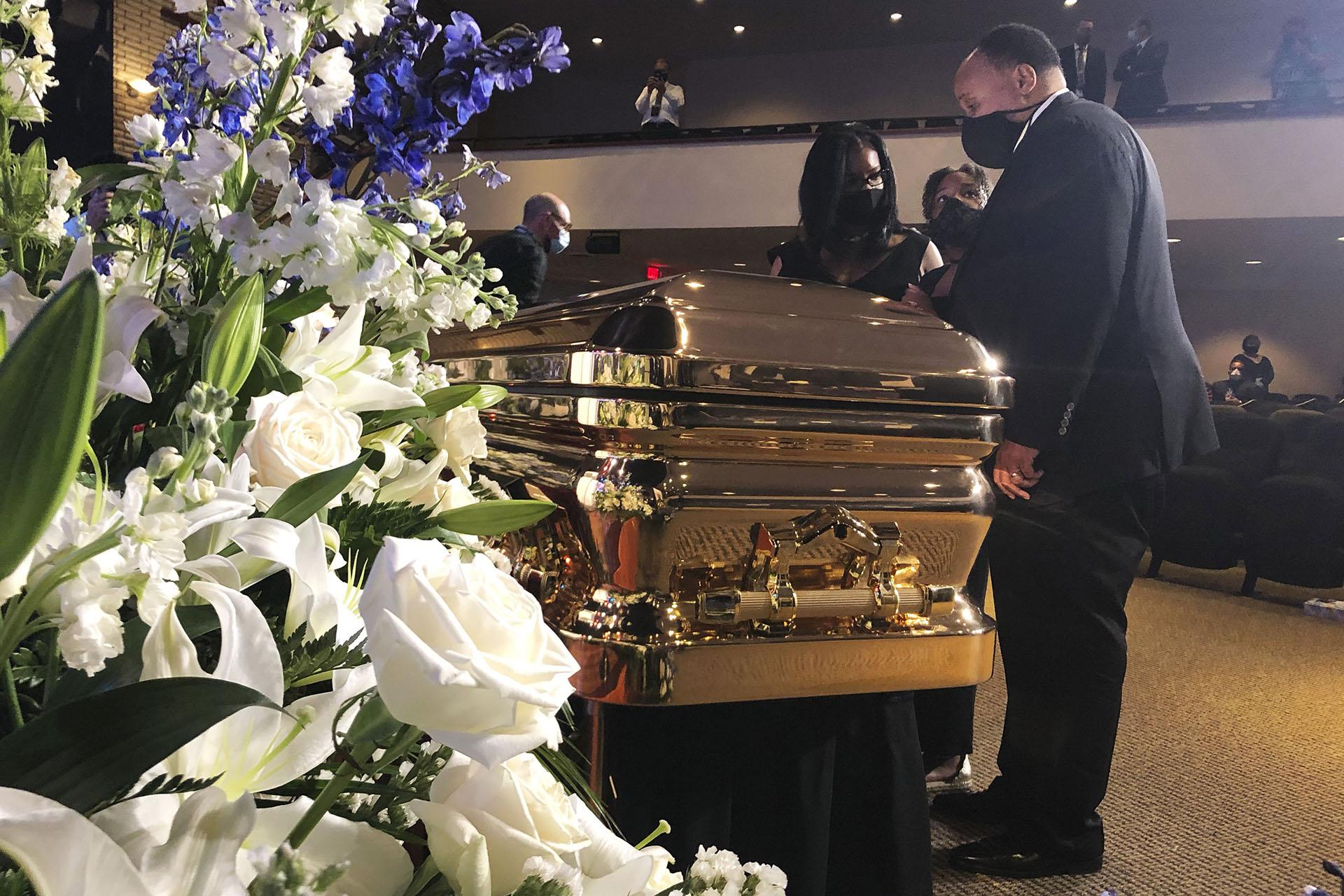 Martin Luther King III takes a moment by George Floyd’s casket Thursday, June 4, 2020, before a memorial service for George Floyd in Minneapolis. (AP Photo / Bebeto Matthews)