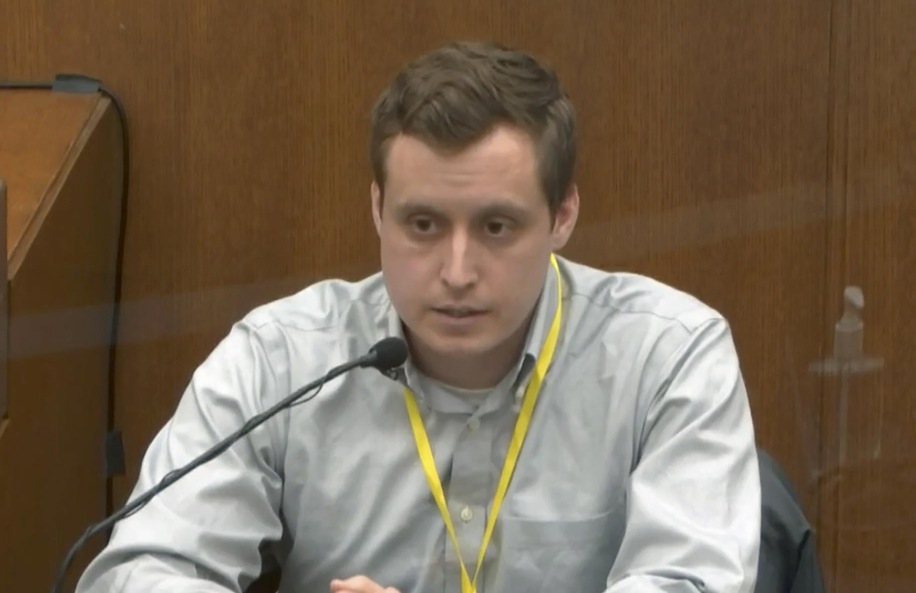 In this image from video, witness Dr. Bradford Wankhede Langenfeld, the doctor who pronounced George Floyd dead, testifies as Hennepin County Judge Peter Cahill presides Monday, April 5, 2021, in the trial of former Minneapolis police Officer Derek Chauvin at the Hennepin County Courthouse in Minneapolis. (Court TV via AP, Pool)
