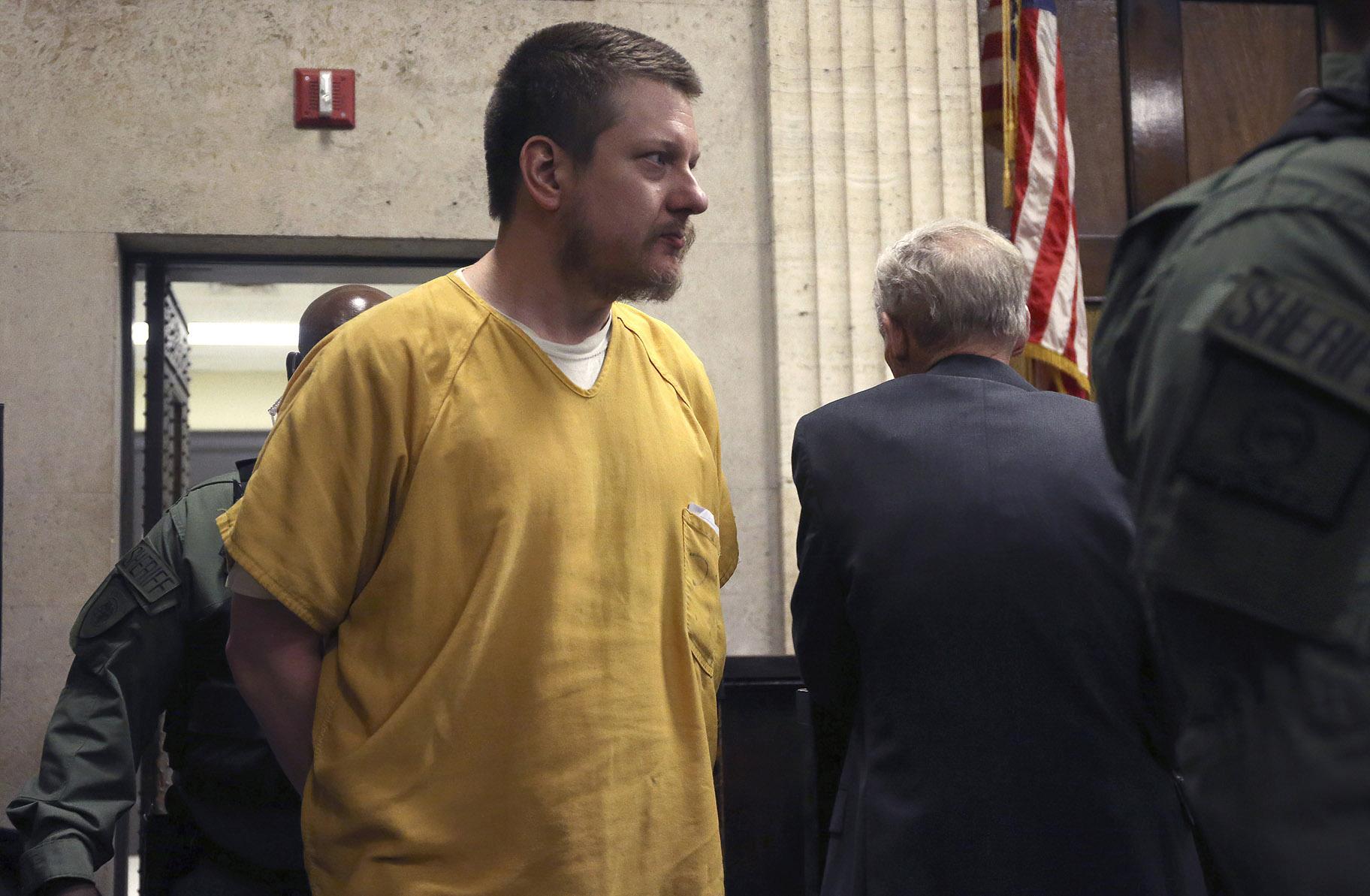 In this Jan. 18, 2019, file photo, former Chicago police Officer Jason Van Dyke is escorted into the courtroom for his sentencing hearing in Chicago, for the 2014 shooting of Laquan McDonald. (Antonio Perez / Chicago Tribune via AP, Pool, File)