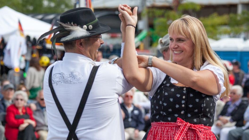 Dress code for this weekend's Oktoberfest in Lincoln Square: traditional lederhosen and dirndl dresses. Or, just grab a beer and pretzel. (Courtesy Chicago German-American Oktoberfest)