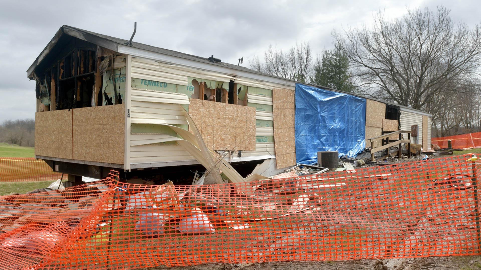 This photo taken April 7, 2019, shows a fence and caution tape surrounding a trailer home that was destroyed by fire in the Timberline Mobile Home Park northeast of Goodfield. (Matt Dayhoff / Journal Star via AP)