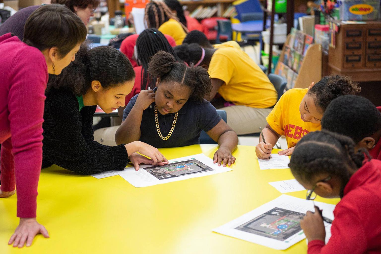 Students and teachers at Webster Elementary School in the Lawndale neighborhood review plans for a new schoolyard funded through the Space to Grow initiative. (Courtesy Metropolitan Water Reclamation District of Greater Chicago) Students and teachers at Webster Elementary School in the Lawndale neighborhood review plans for a new schoolyard funded through the Space to Grow initiative. (Courtesy Metropolitan Water Reclamation District of Greater Chicago)