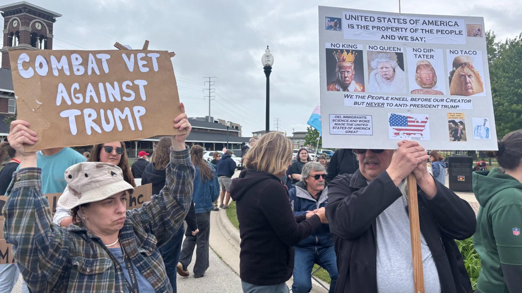 Demonstrators in Green Bay, Wisconsin, protest the Trump administration during a “No Kings” rally on Saturday, June 14, 2025. (Shelby Hawkins / WTTW News)