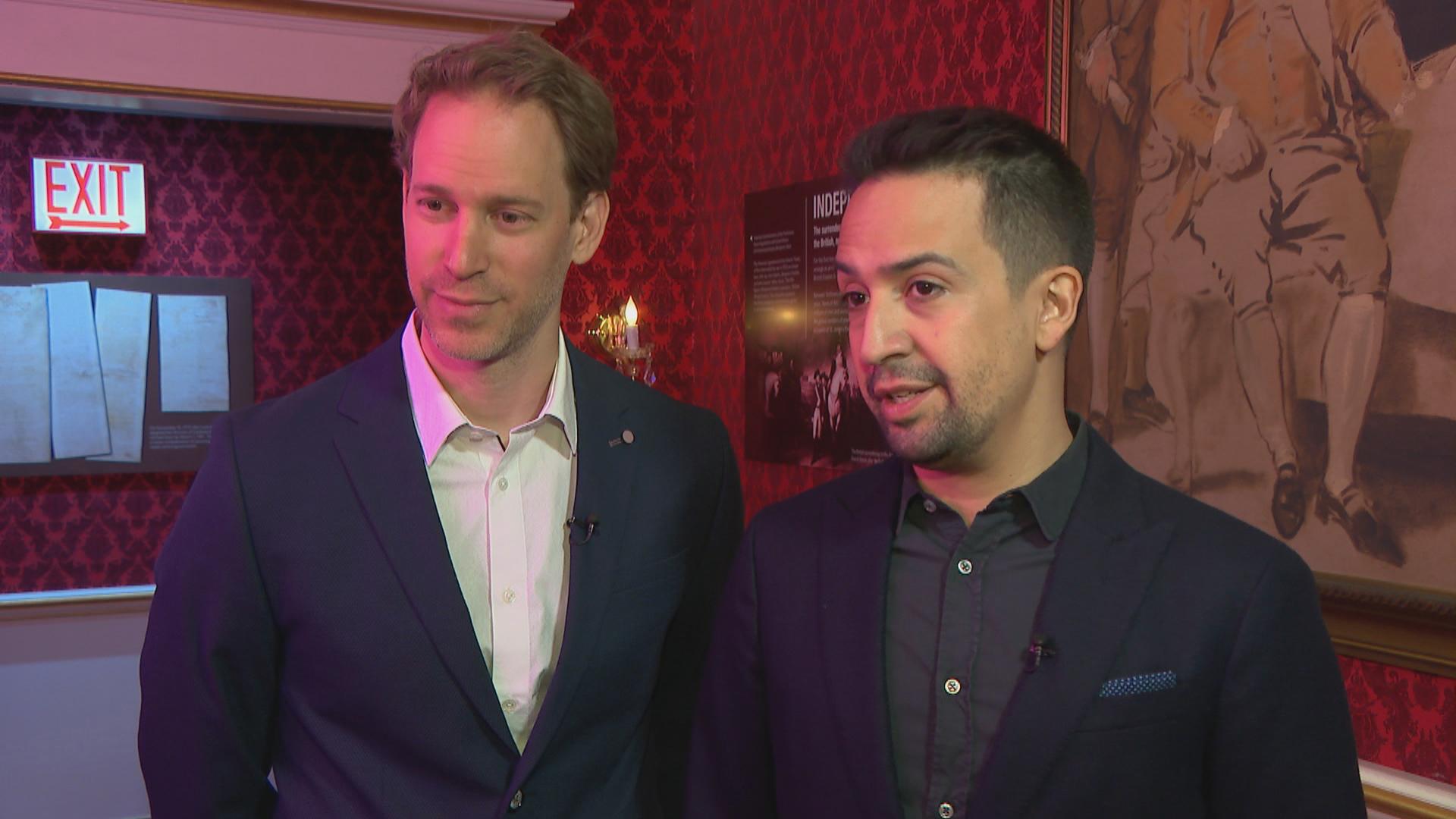 “Hamilton” creator Lin-Manuel Miranda, left, and exhibition designer David Korins speak with WTTW News at “Hamilton: The Exhibition.”