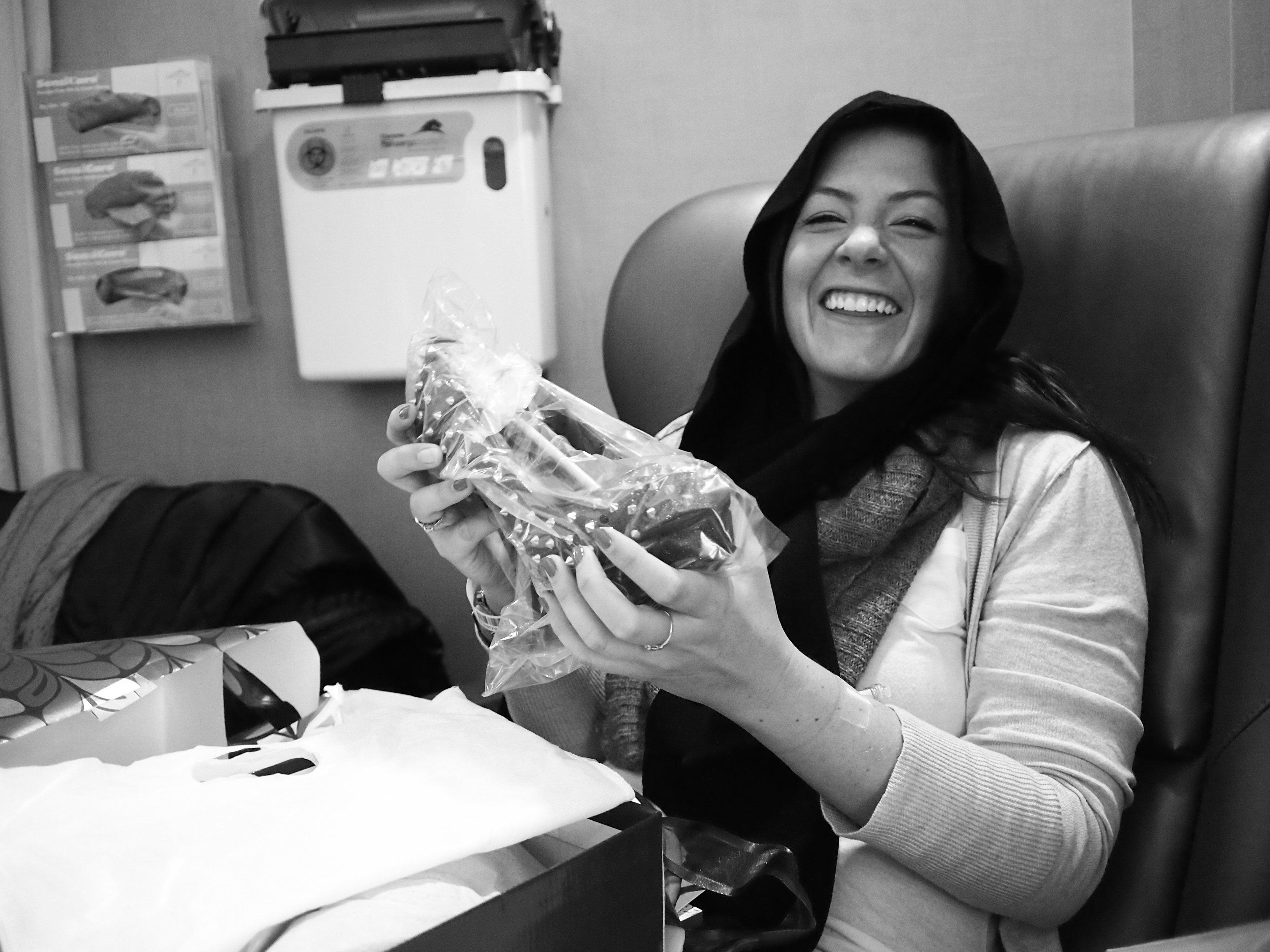 Lauren Truelock receives her “chemo shoes” on her first day of chemotherapy from Sidne Hirsch. (Sidne Hirsch Photography)