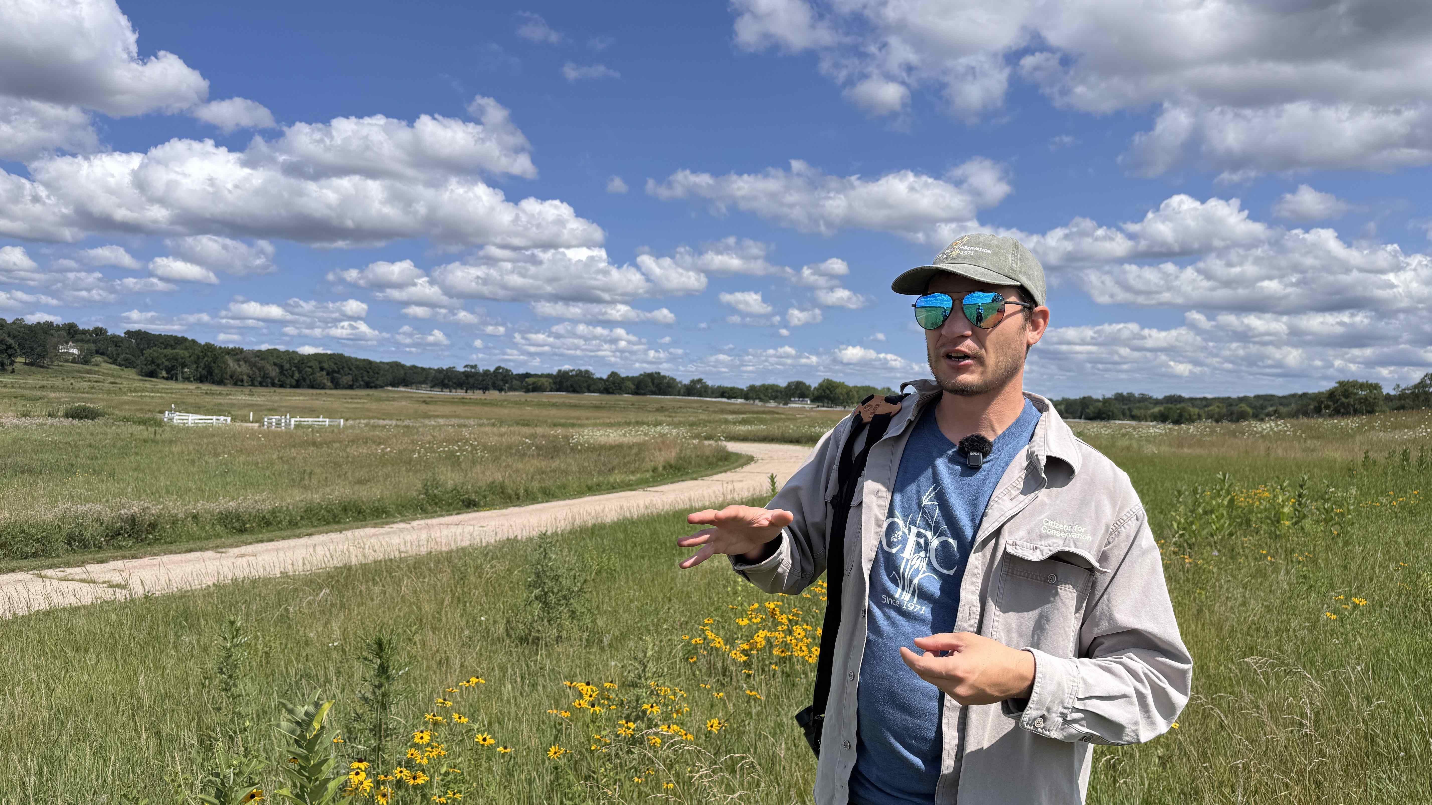 Luke Dahlberg describes the methodical approach he's taking to seeding native plants at Hill 'N Dale, beginning with a two-acre area. (Patty Wetli / WTTW News)